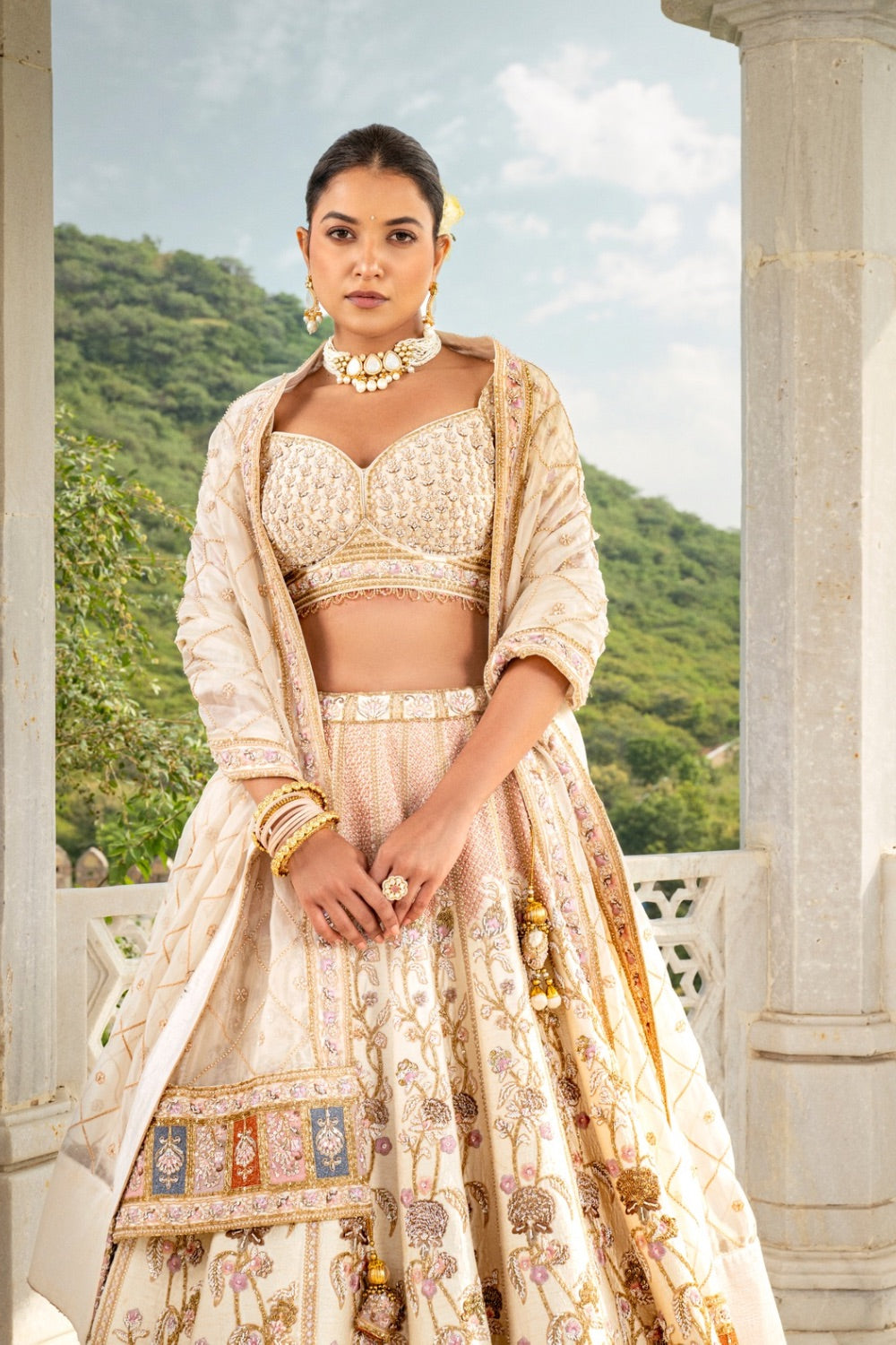 Ivory raw silk lehenga choli with purple zardozi, hand cut dana and resham work