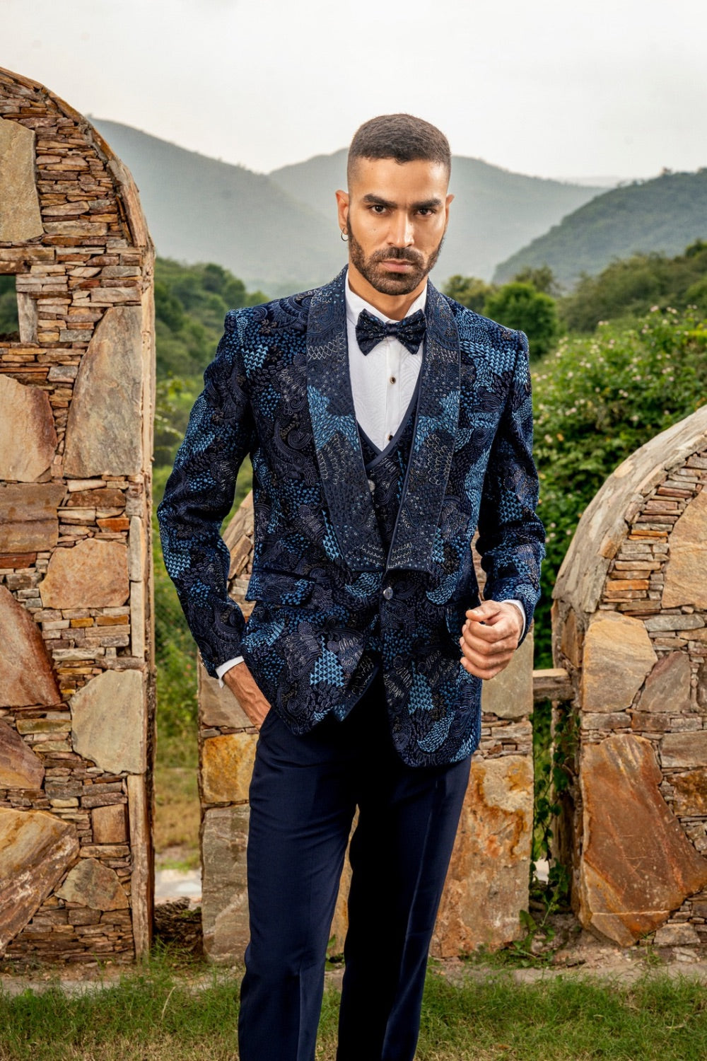 Blue five piece suiting tuxedo with pearl and hand cut dana work