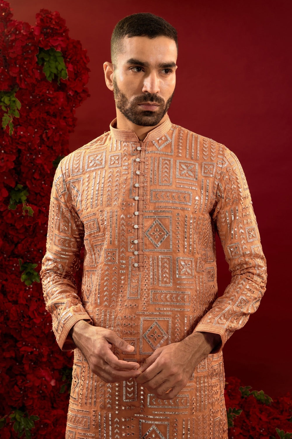 Orange silk kurta set with hand and machine work