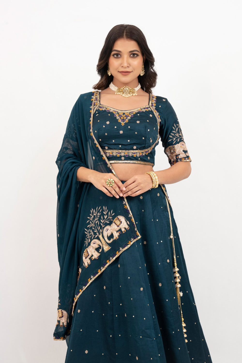 Peacock blue soft silk zardozi embroidered lehenga choli with hand cut dana work