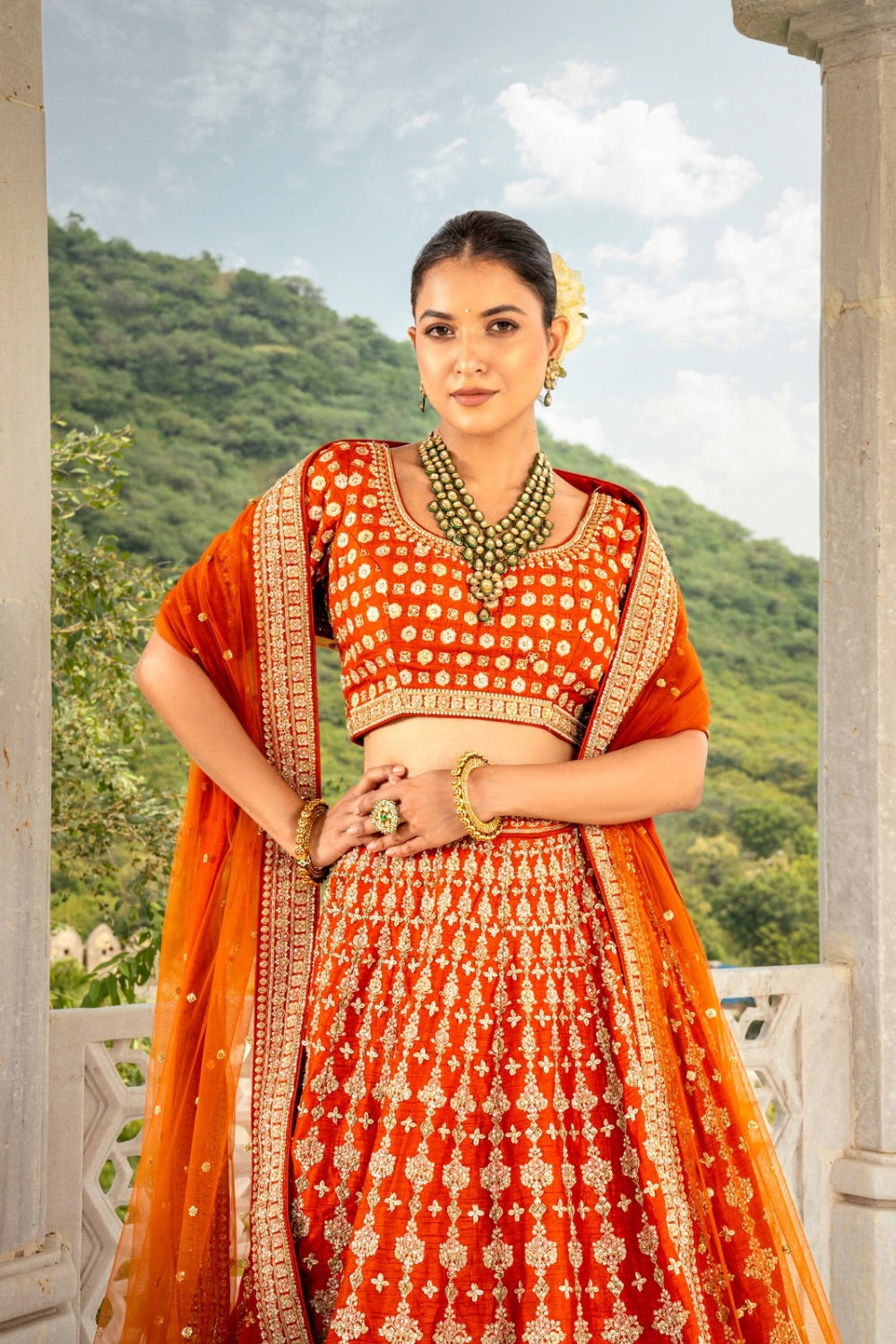 Coral orange raw silk lehenga choli with zardozi and hand cut dana work