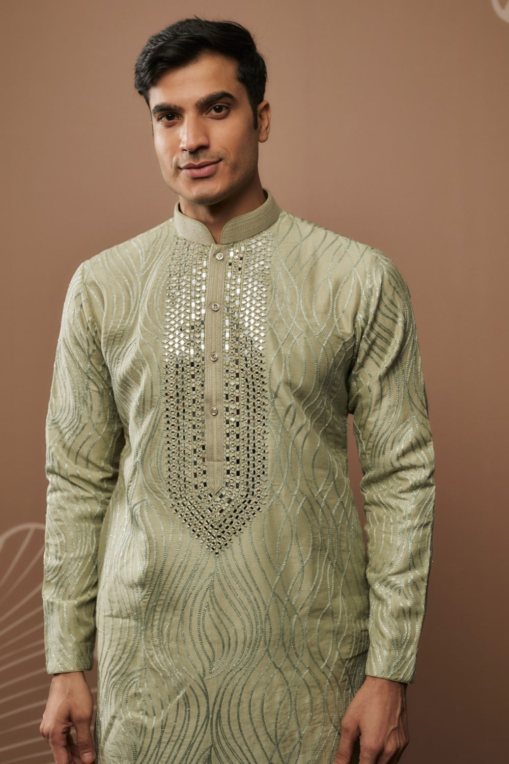 Sage green silk kurta set with hand and machine work