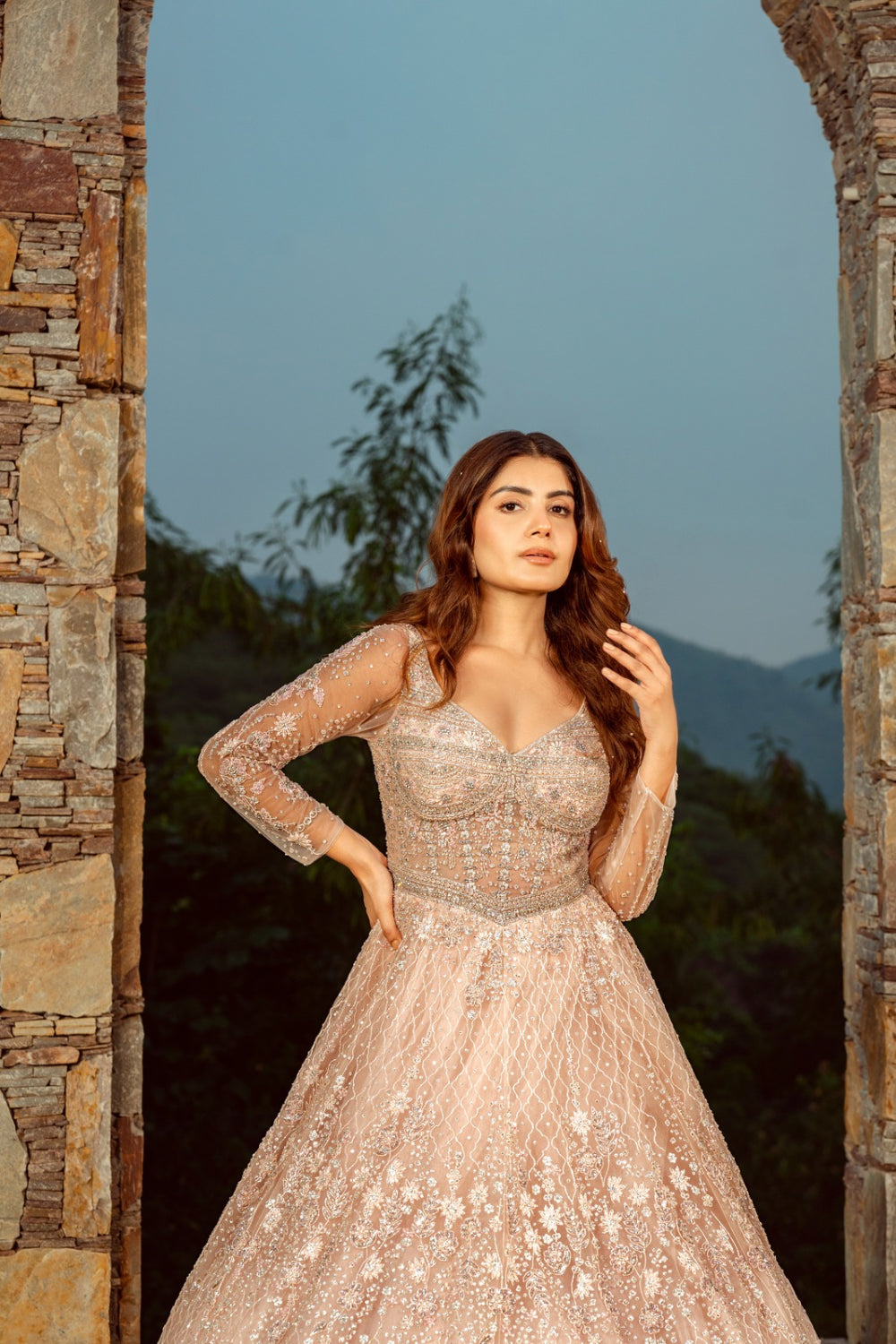 Baby pink net gown with sequins and stone work