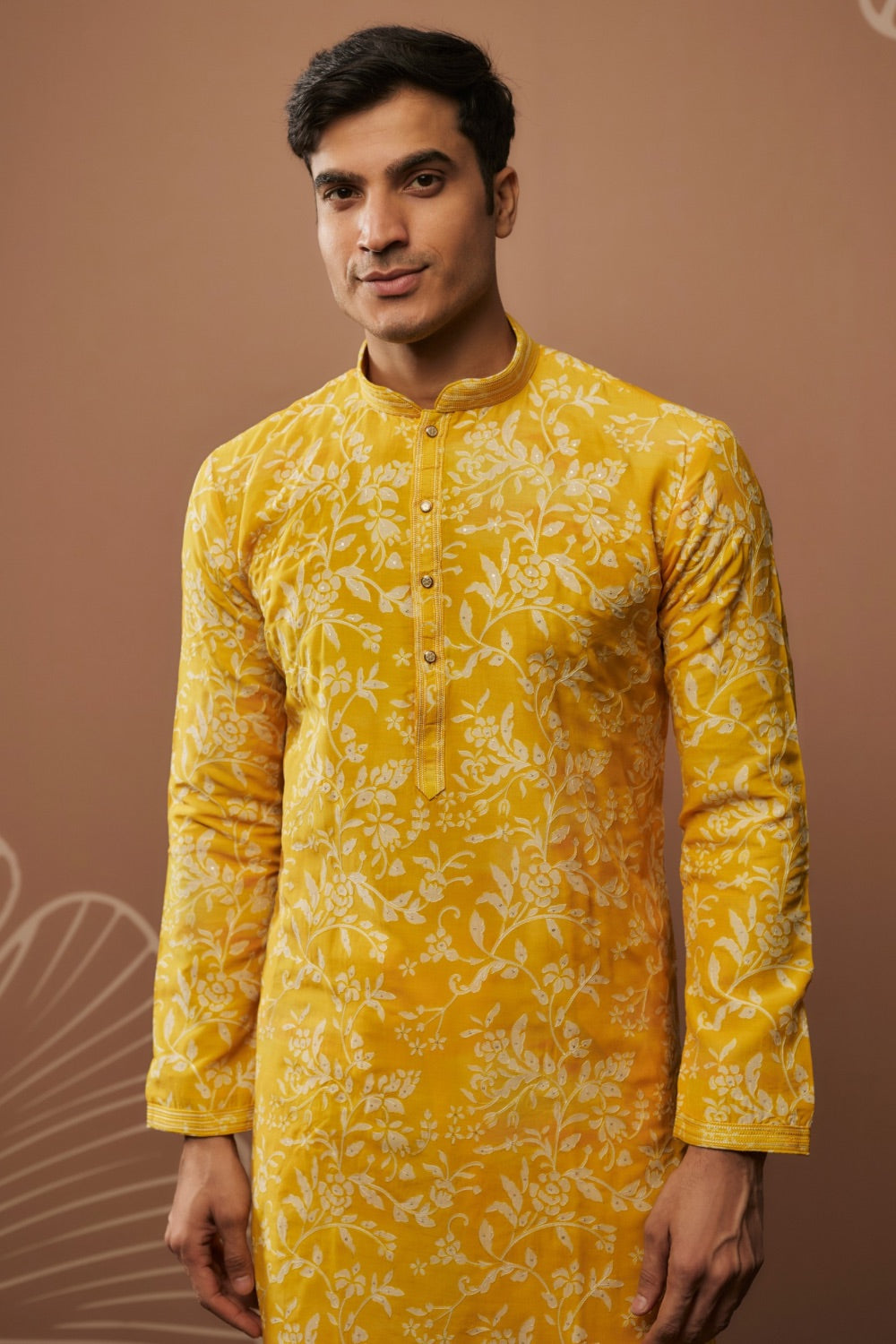 Bright yellow silk kurta and pajama with hand and machine work