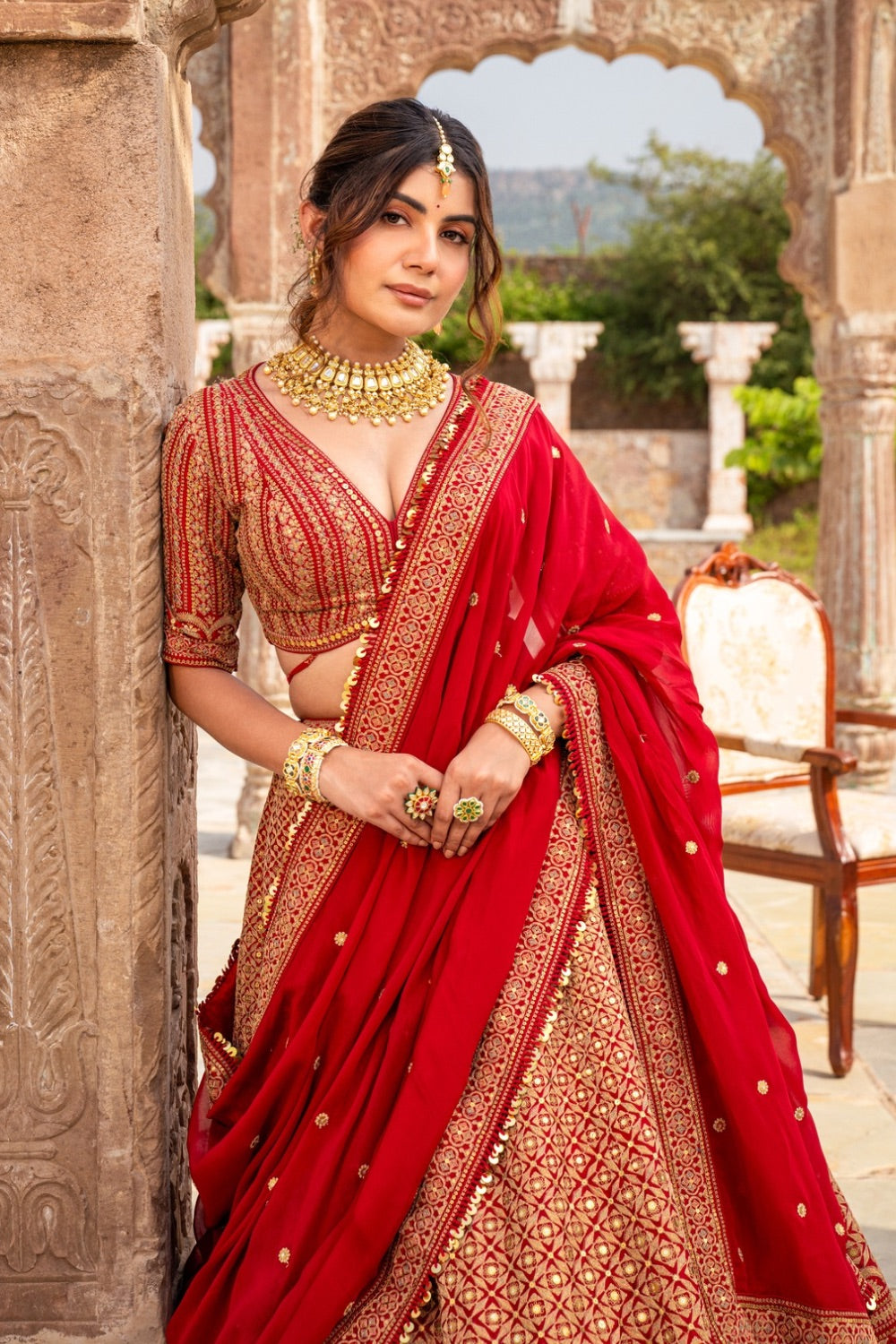 Cherry red raw silk bridal lehenga choli with marodi work