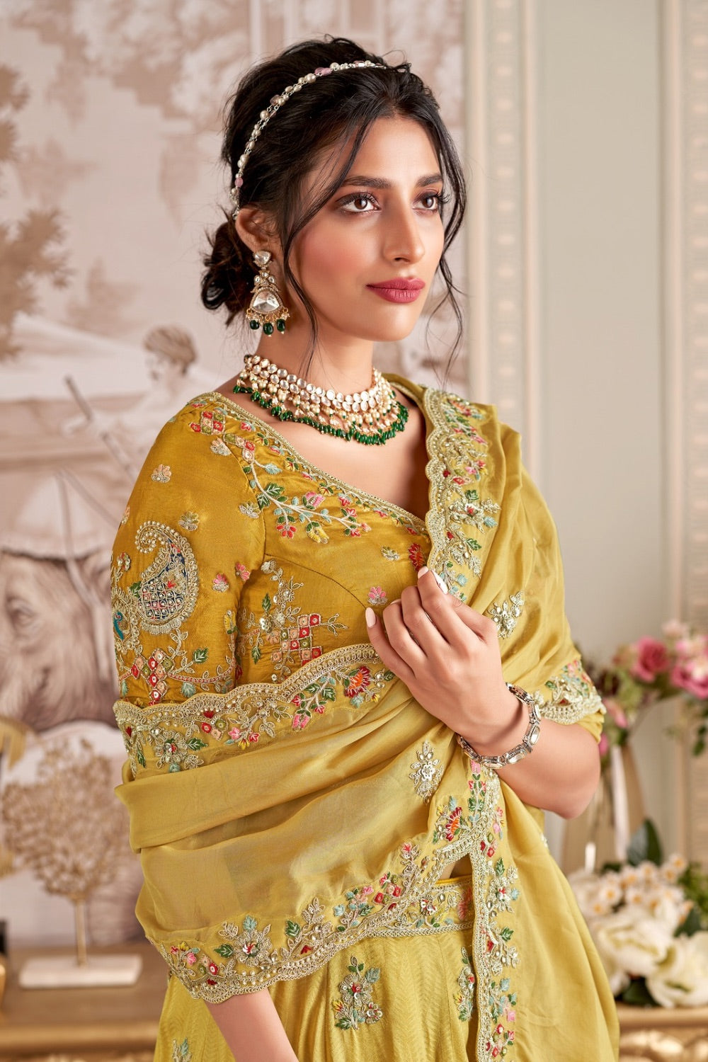 Yellow soft silk lehenga choli with machine and hand work