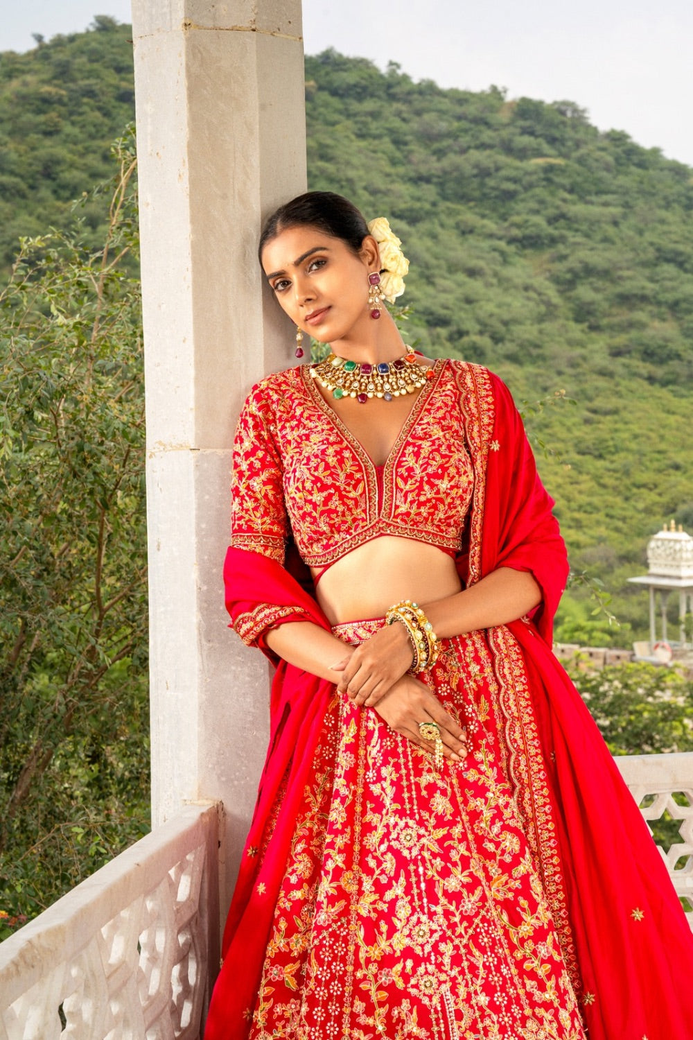 Bright red soft silk lehenga choli with zardozi and hand cut dana work