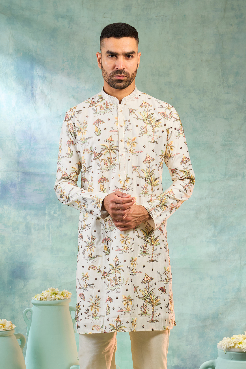 Ivory silk kurta set with multi coloured thread embroidery work