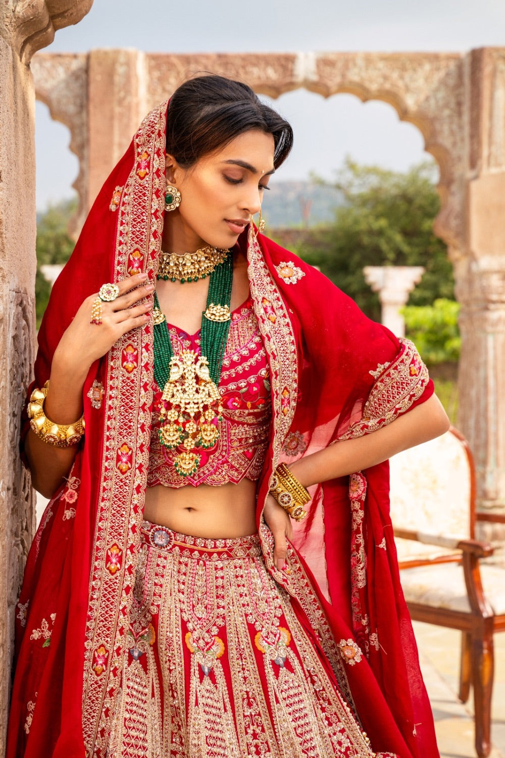 Red raw silk zardozi embroidered bridal lehenga choli with resham and sequin work