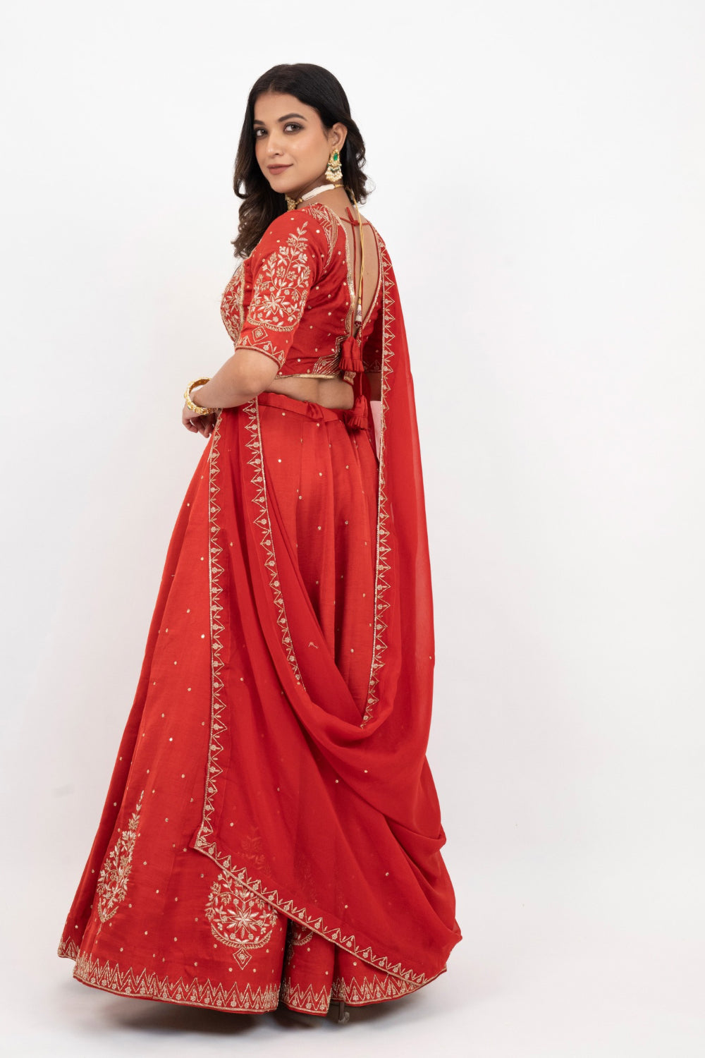 Rust soft silk zardozi embroidered lehenga choli with hand cut dana work