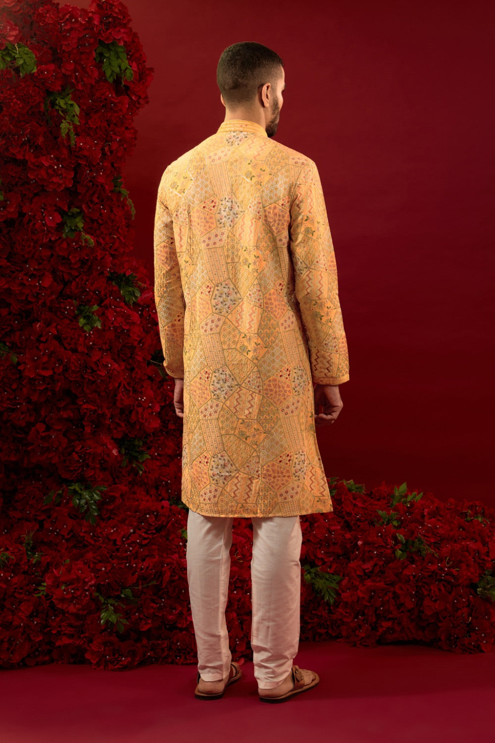 Orange silk kurta set with hand and machine work