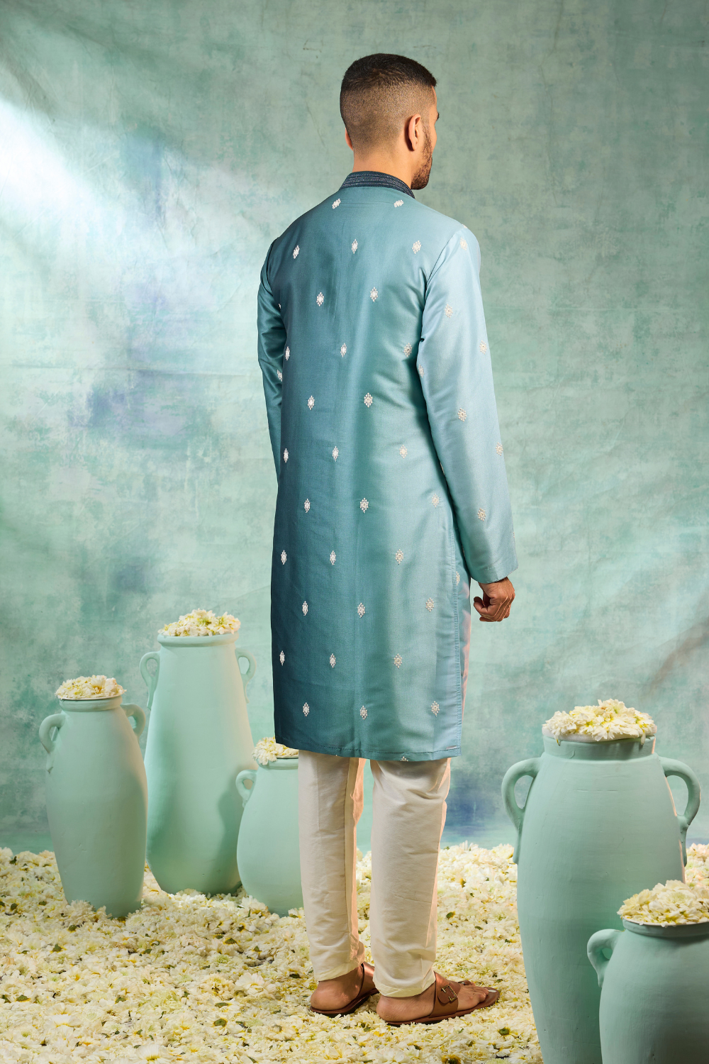 Blue silk kurta set with white motifs