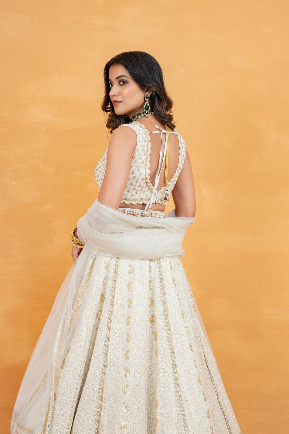 Ivory lucknowi zardozi embroidered lehenga choli with sequins work and pearls