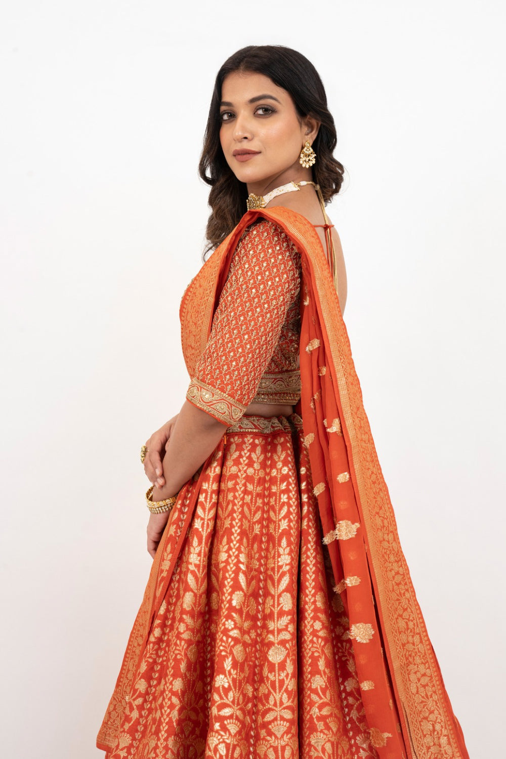 Orange banarasi silk zardozi embroidered lehenga choli with sequins work