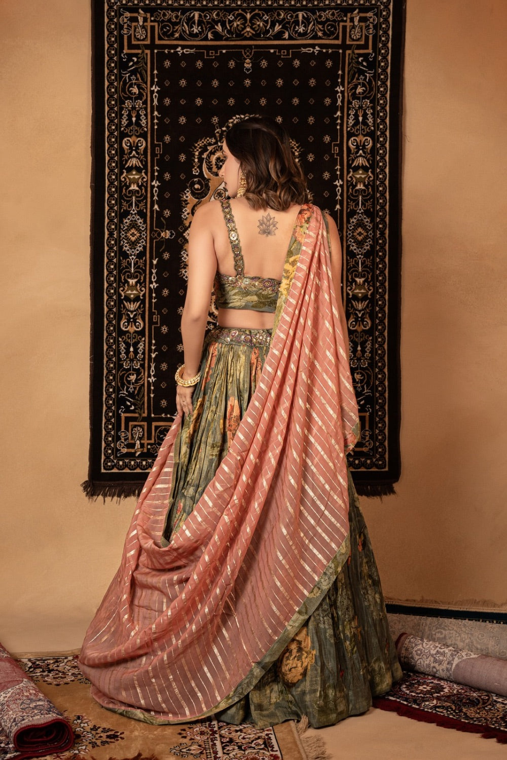 Sage green tissue printed silk lehenga choli with knot and cut dana work