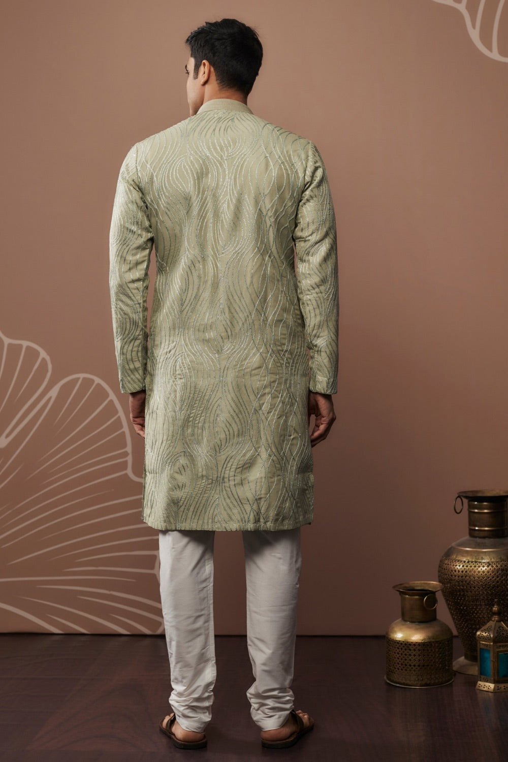 Sage green silk kurta set with hand and machine work