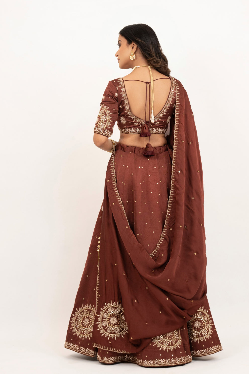 Brown soft silk zardozi embroidered lehenga choli with hand cut dana