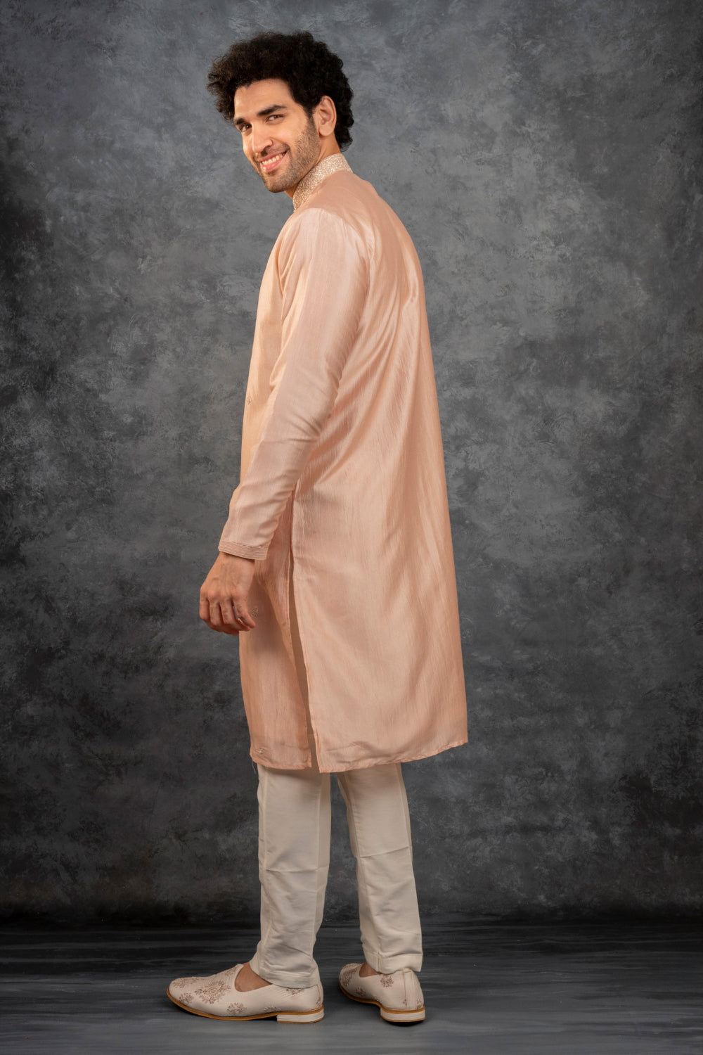 Peach silk kurta set with kasab work on the yoke