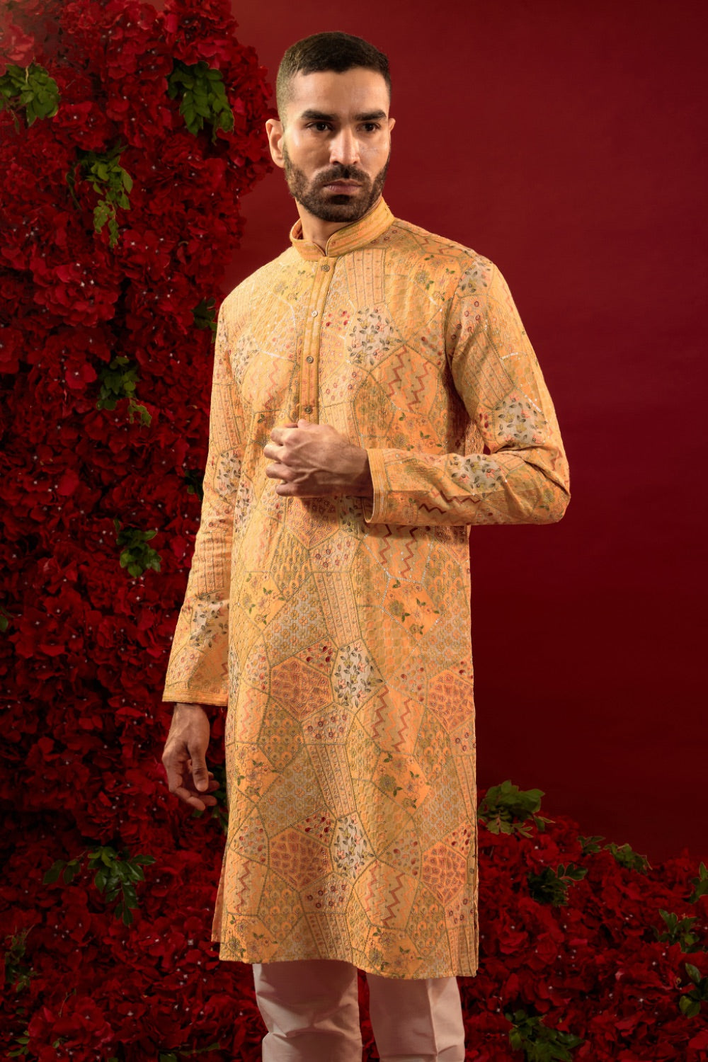 Orange silk kurta set with hand and machine work