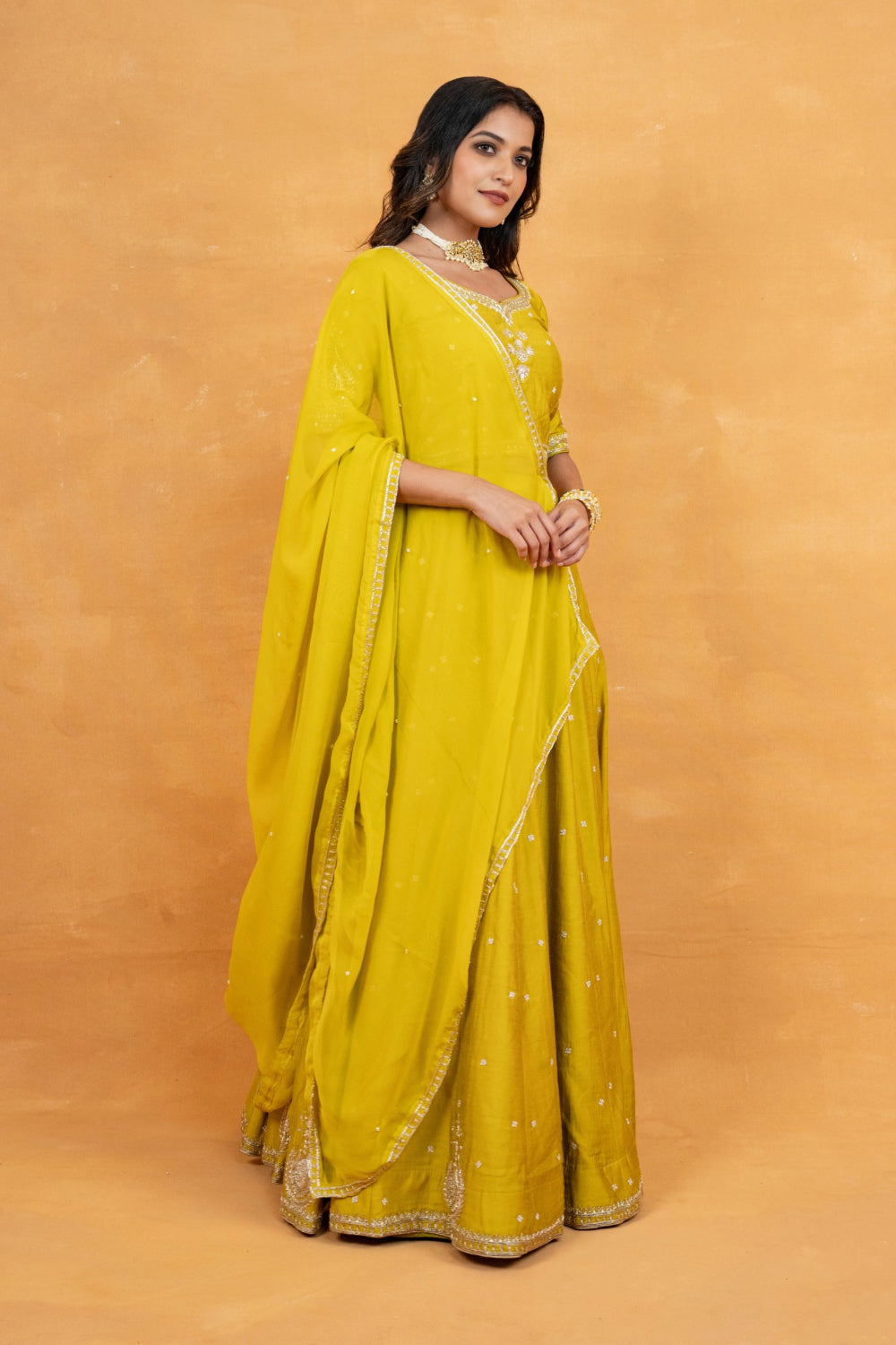 Mustard yellow soft silk zardozi embroidered lehenga choli with hand cut dana and sequin work