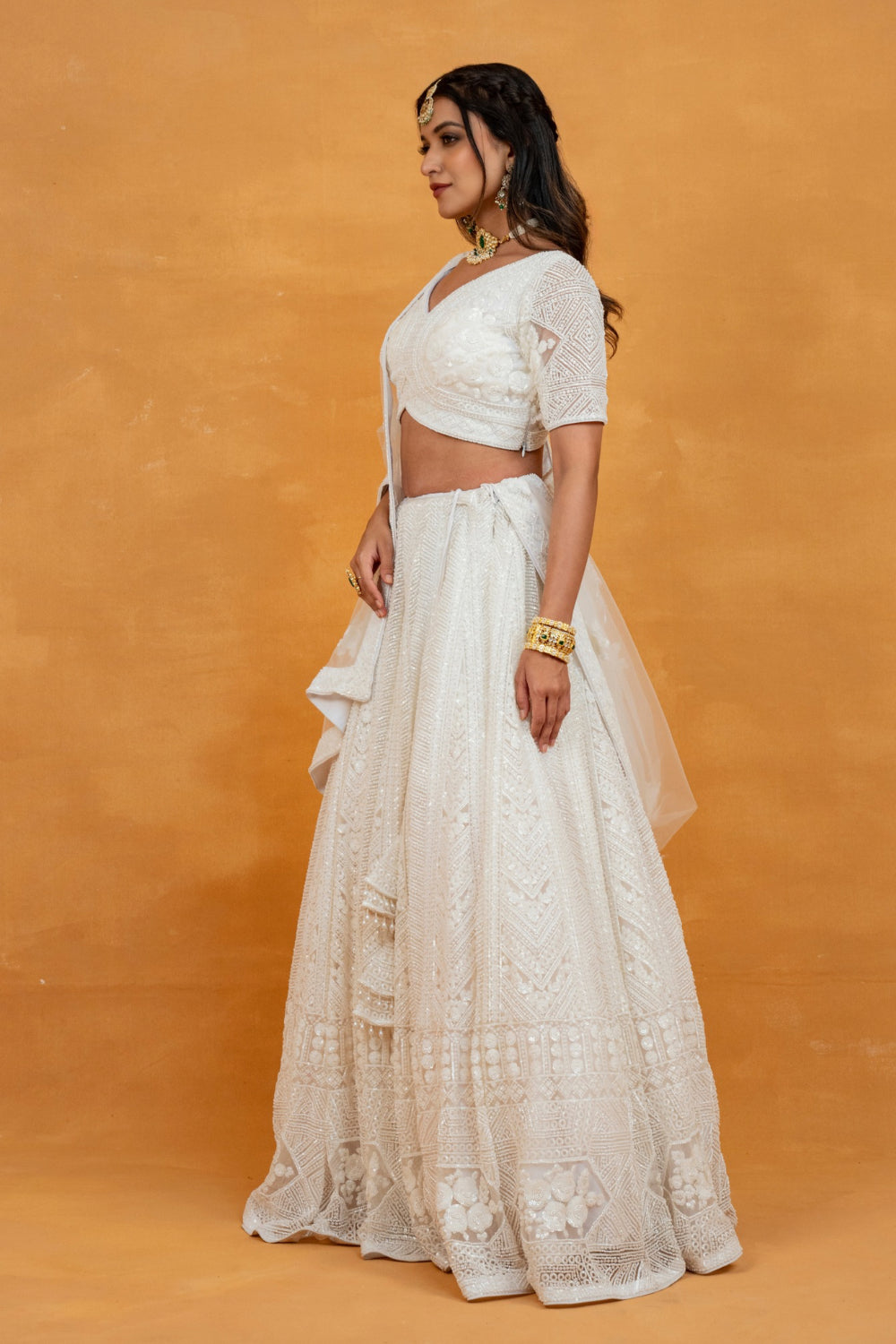 White net lehenga choli with sequin, pearl and cut dana work