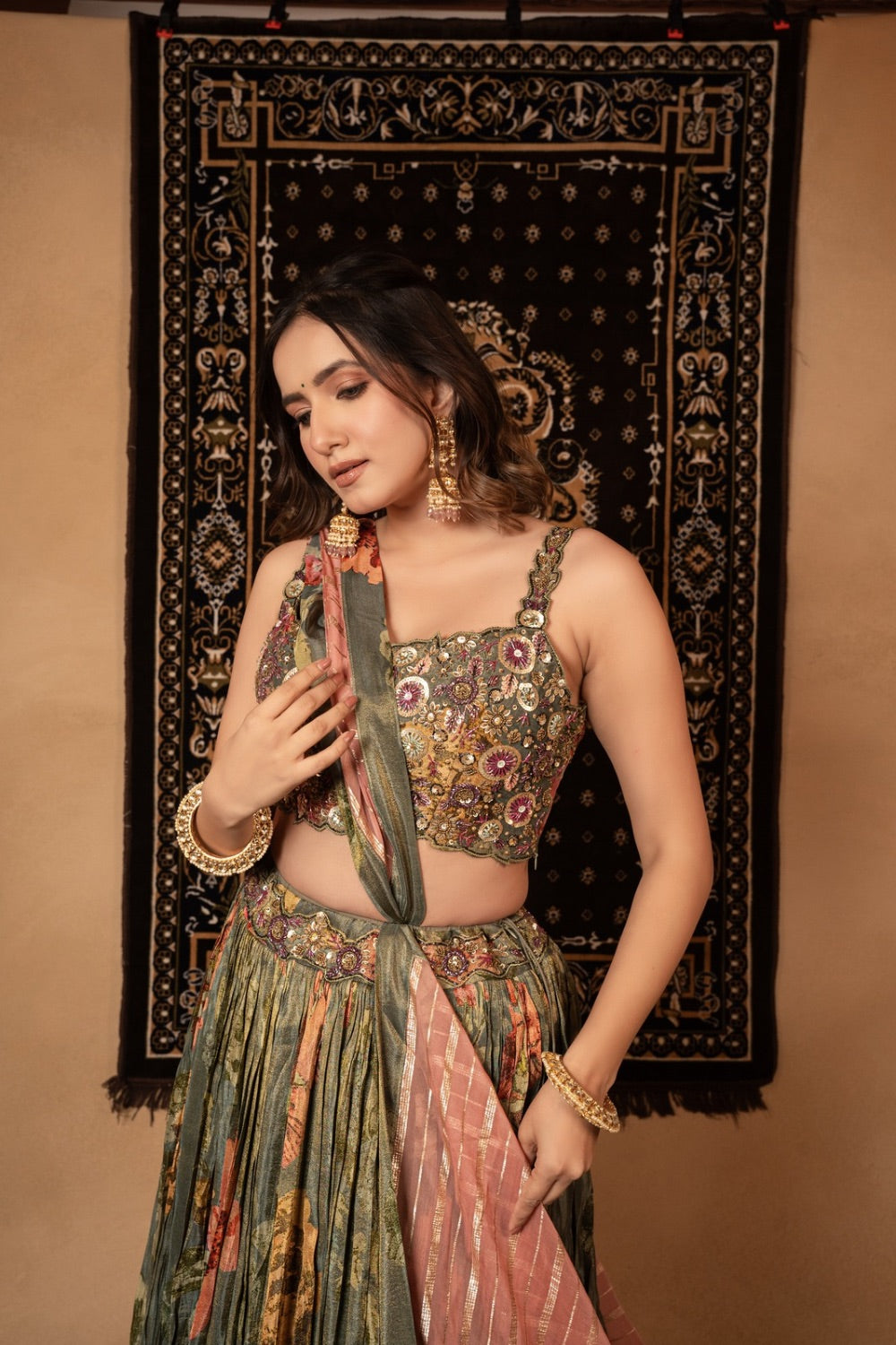 Sage green tissue printed silk lehenga choli with knot and cut dana work