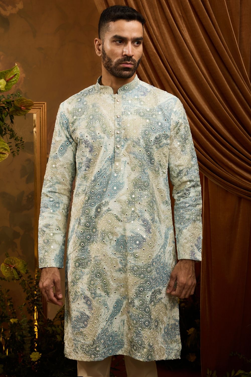 Green silk kurta pajama set with white embroidery and mirror work