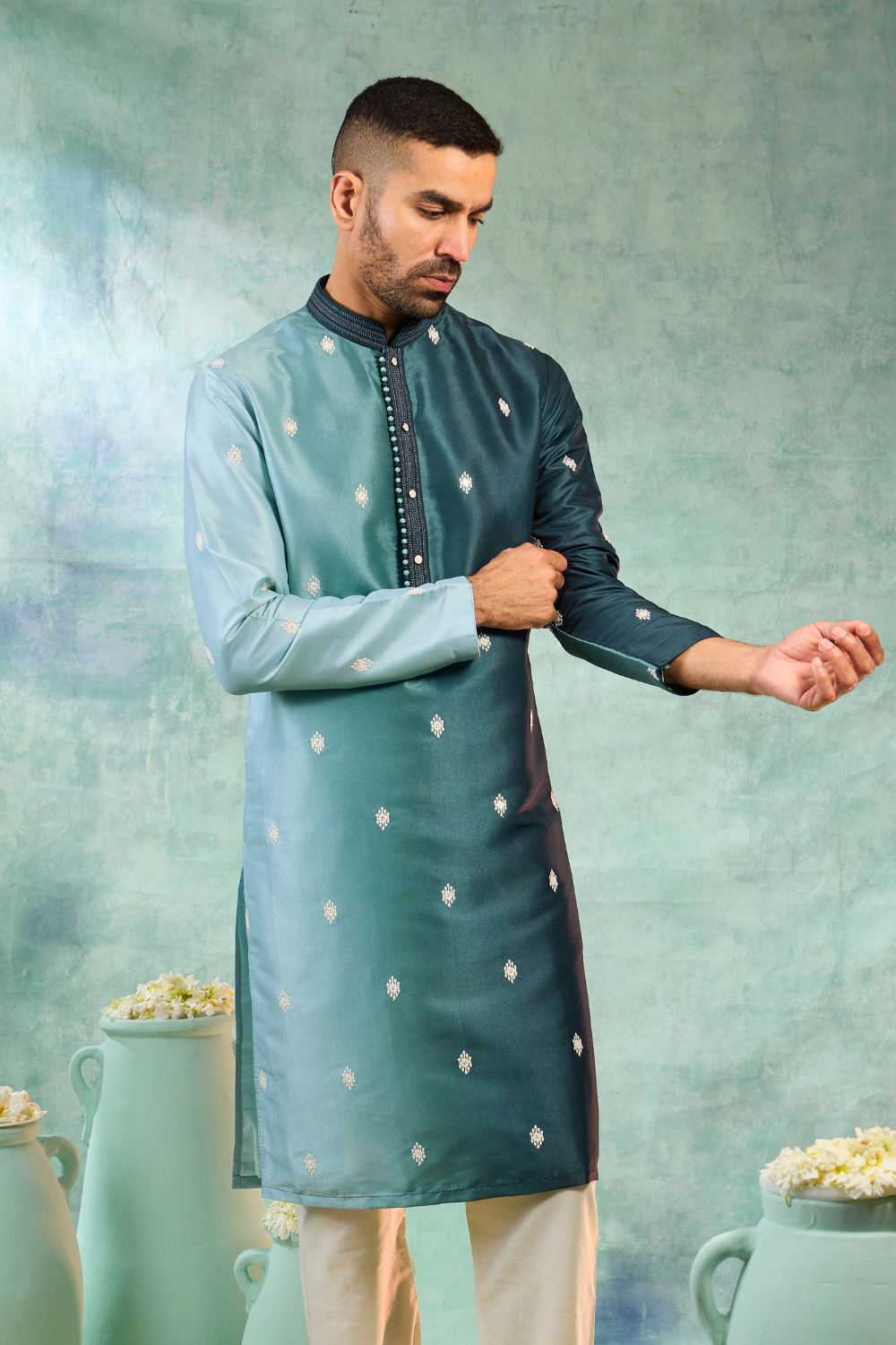 Blue silk kurta set with white motifs