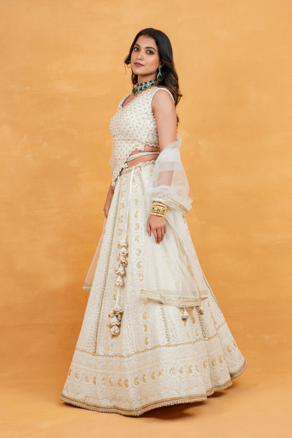 Ivory lucknowi zardozi embroidered lehenga choli with sequins work and pearls