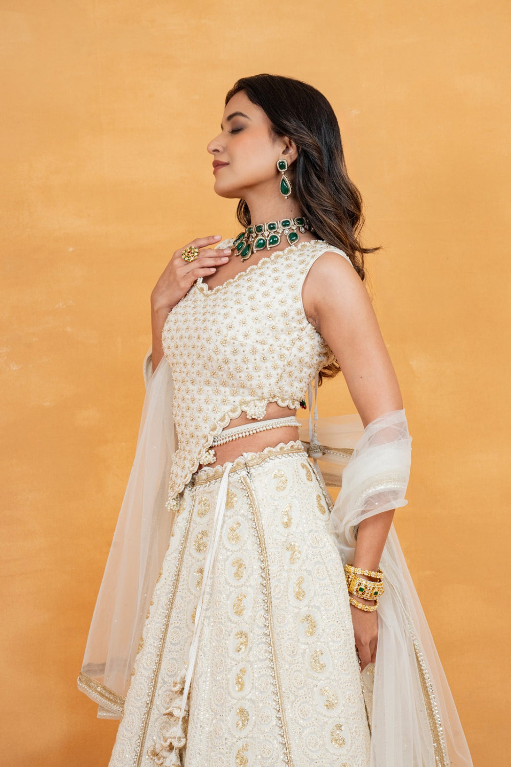 Ivory lucknowi zardozi embroidered lehenga choli with sequins work and pearls