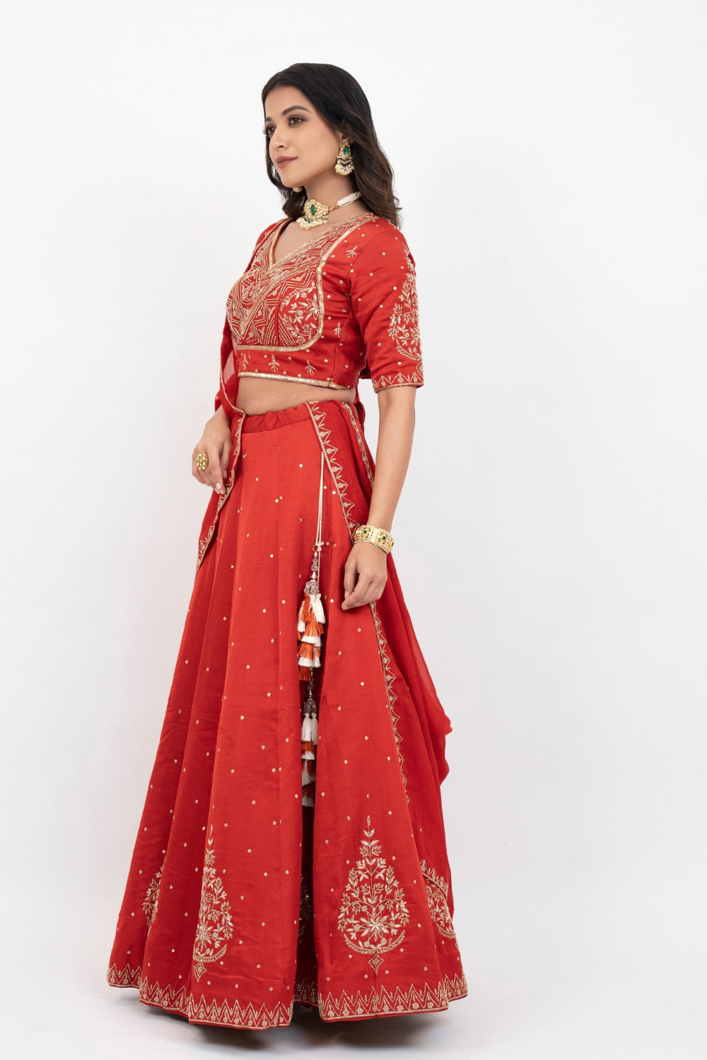 Rust soft silk zardozi embroidered lehenga choli with hand cut dana work