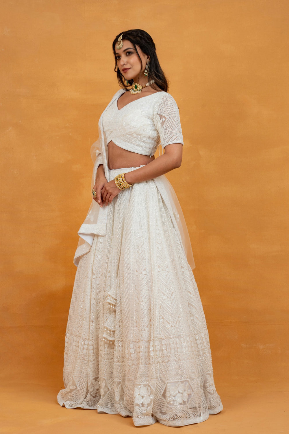 White net lehenga choli with sequin, pearl and cut dana work