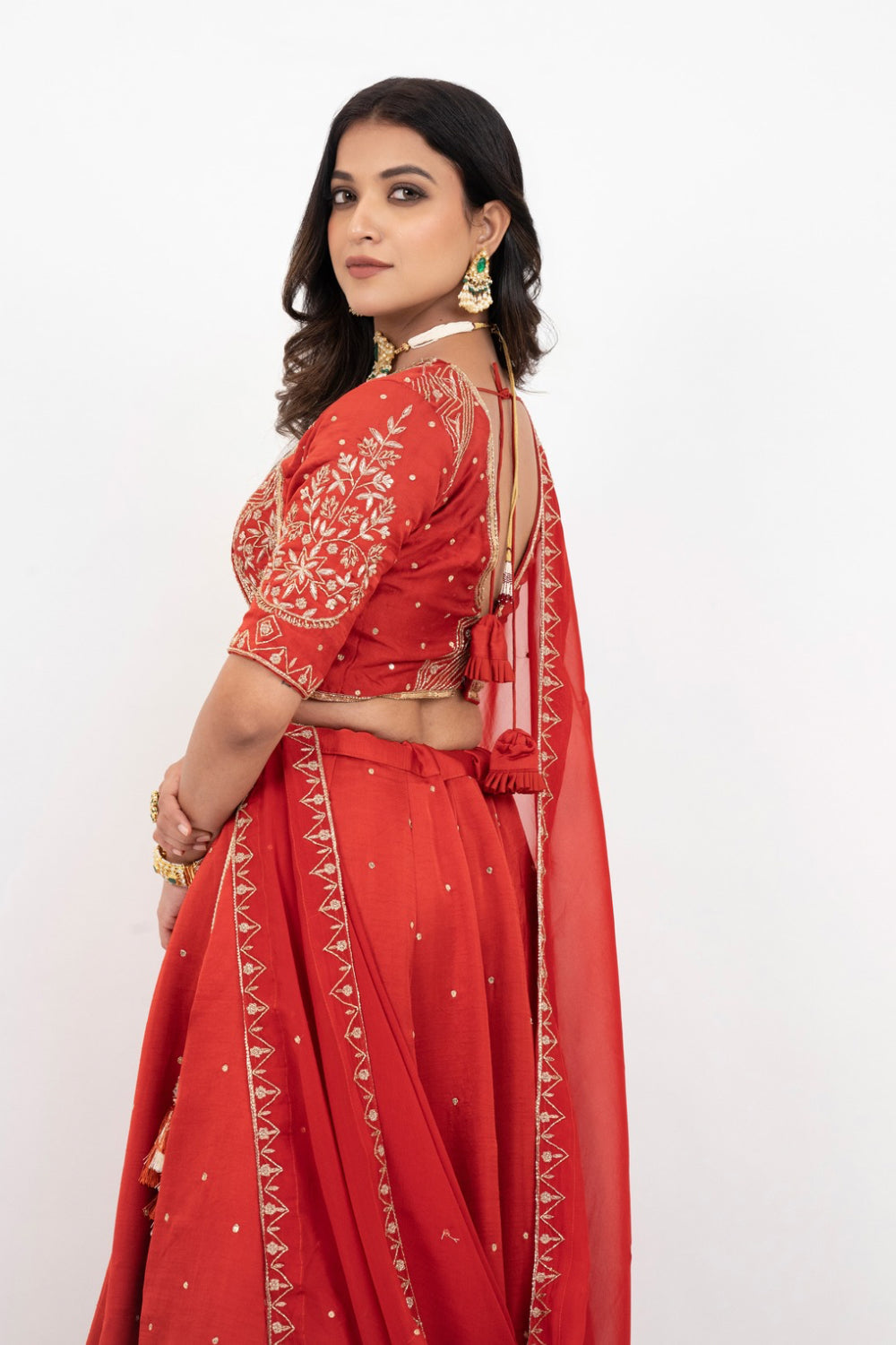 Rust soft silk zardozi embroidered lehenga choli with hand cut dana work