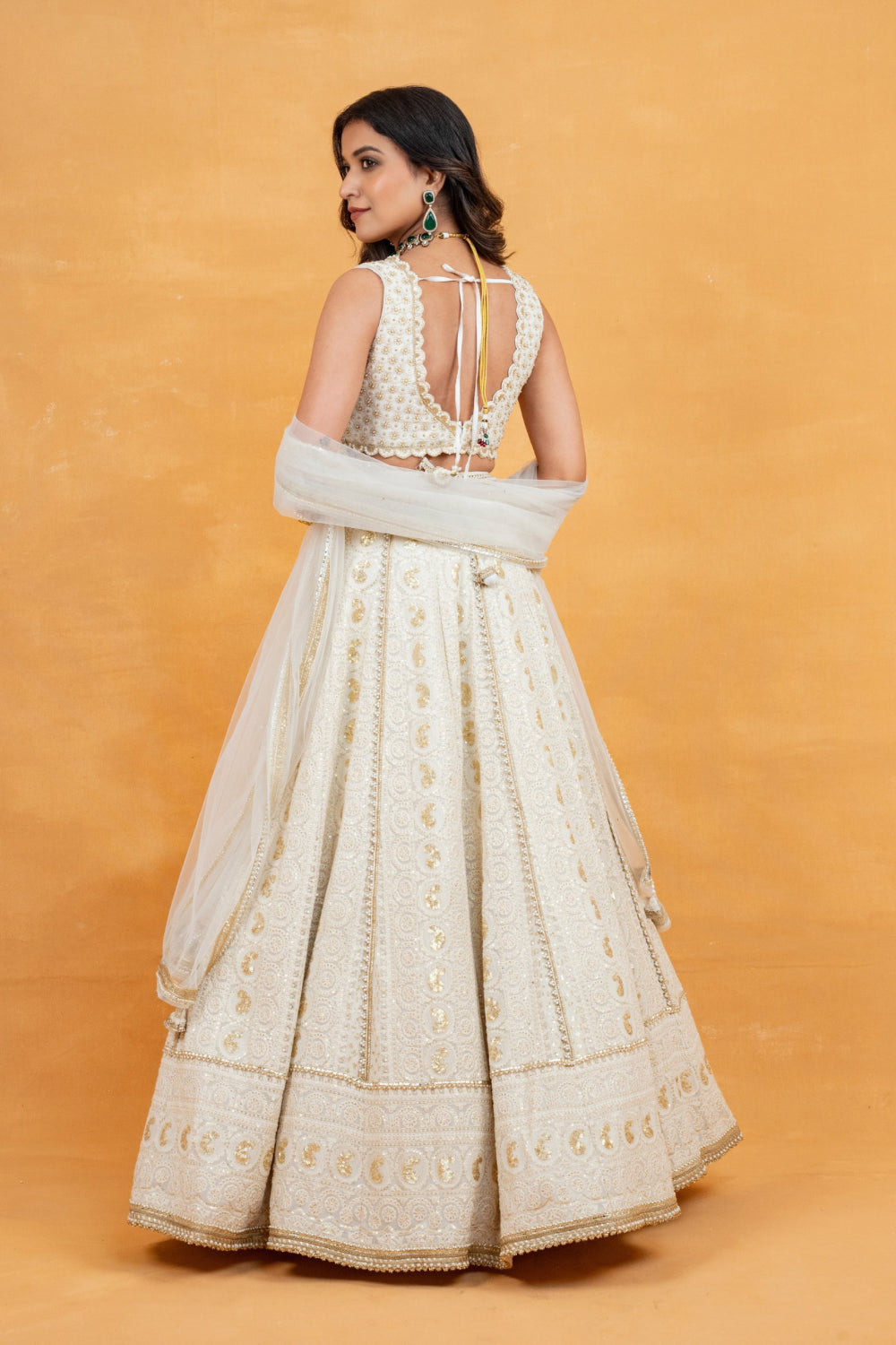 Ivory lucknowi zardozi embroidered lehenga choli with sequins work and pearls