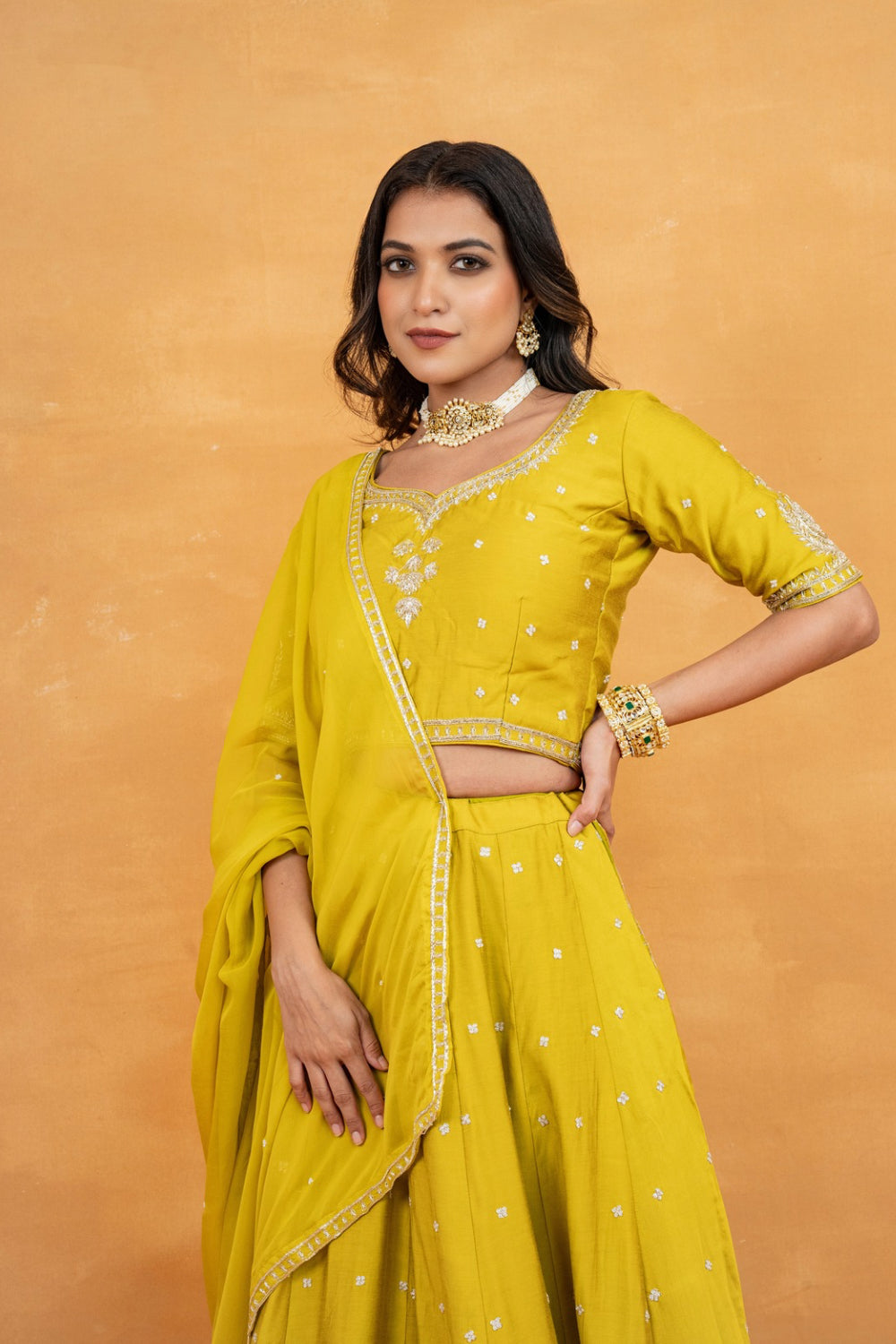 Mustard yellow soft silk zardozi embroidered lehenga choli with hand cut dana and sequin work