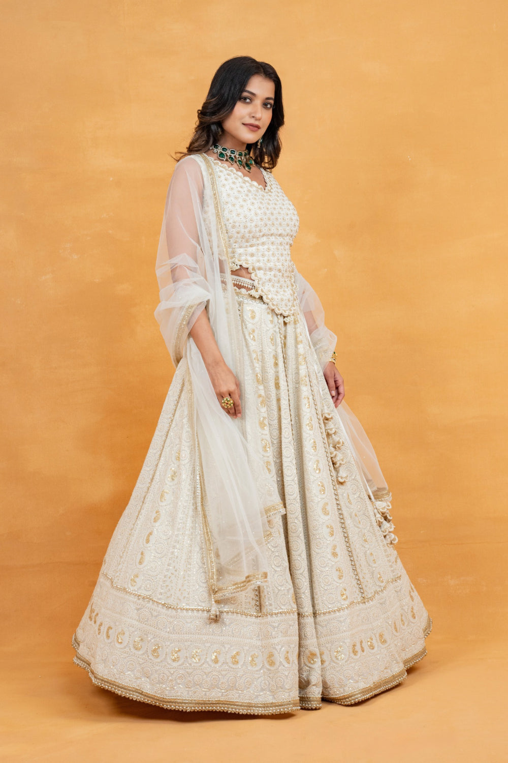 Ivory lucknowi zardozi embroidered lehenga choli with sequins work and pearls