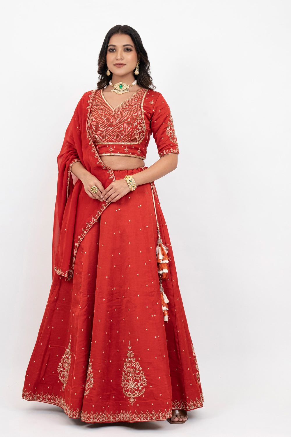 Rust soft silk zardozi embroidered lehenga choli with hand cut dana work