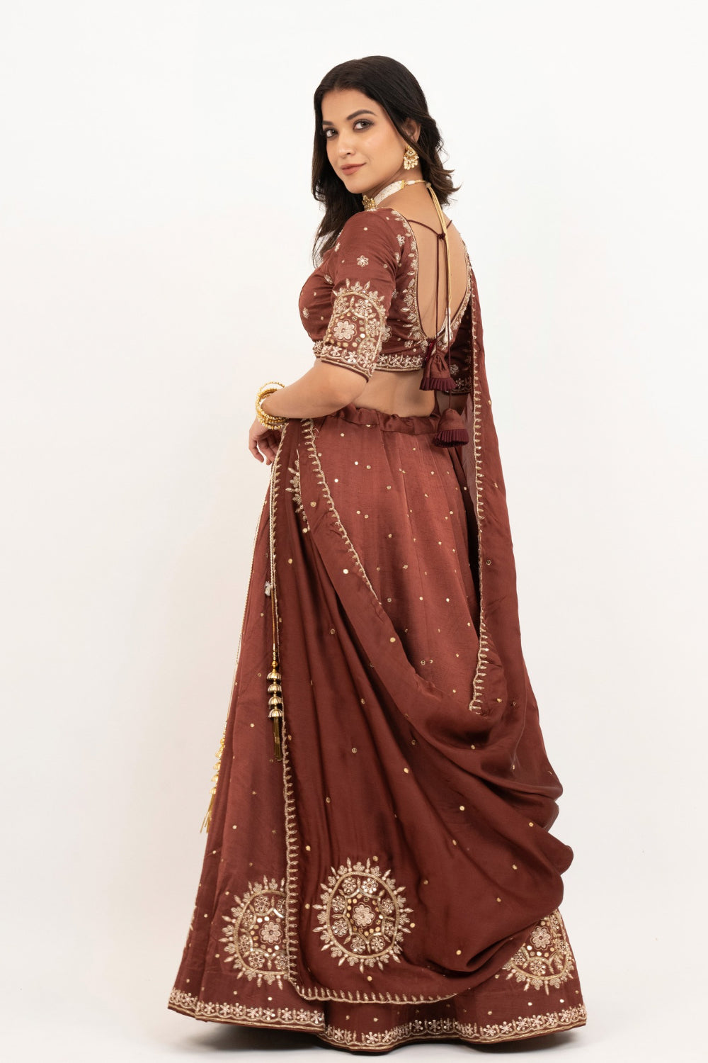 Brown soft silk zardozi embroidered lehenga choli with hand cut dana