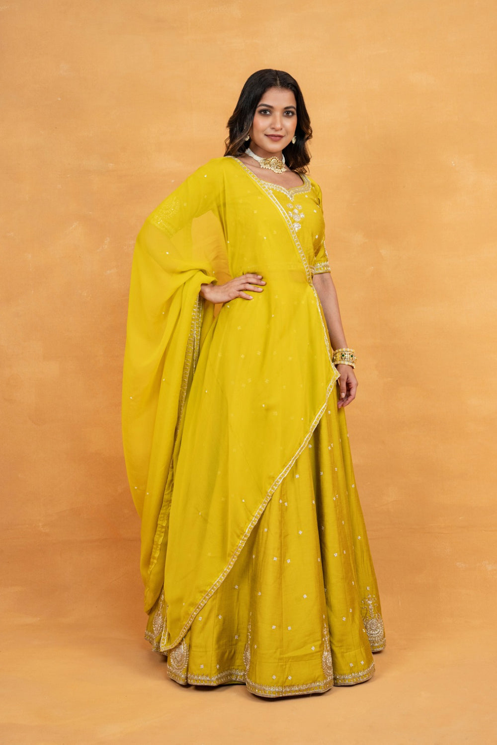 Mustard yellow soft silk zardozi embroidered lehenga choli with hand cut dana and sequin work