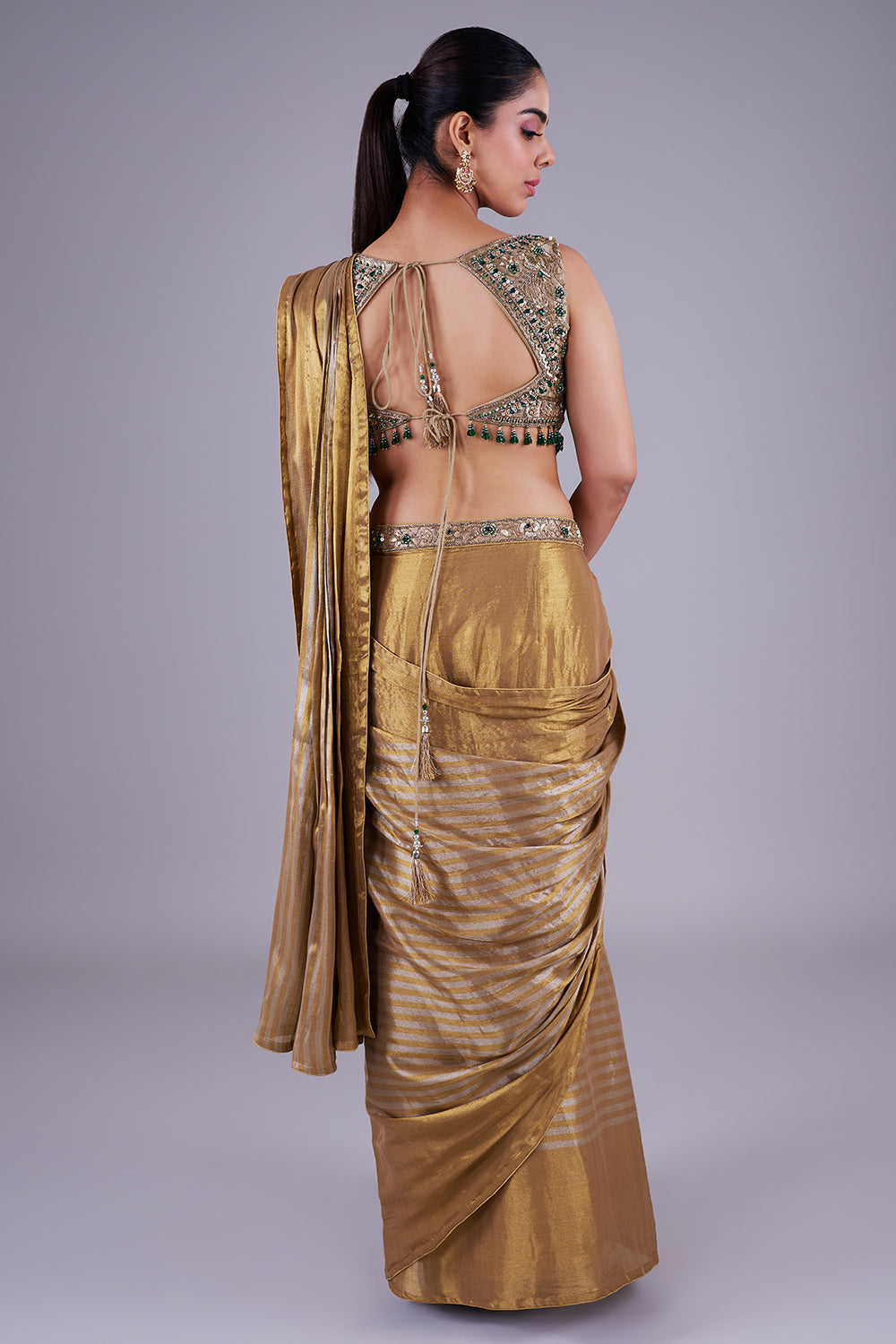 Antique gold drape with emerald blouse