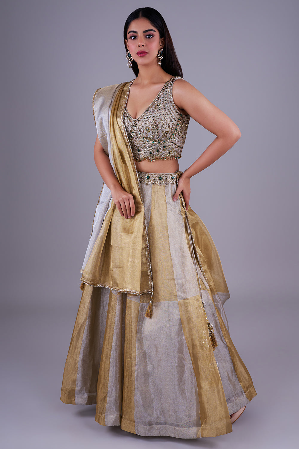 Antique gold with emerald green accents.