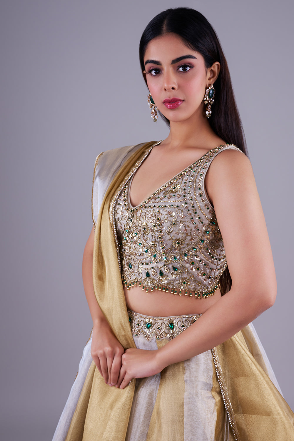 Antique gold with emerald green accents.