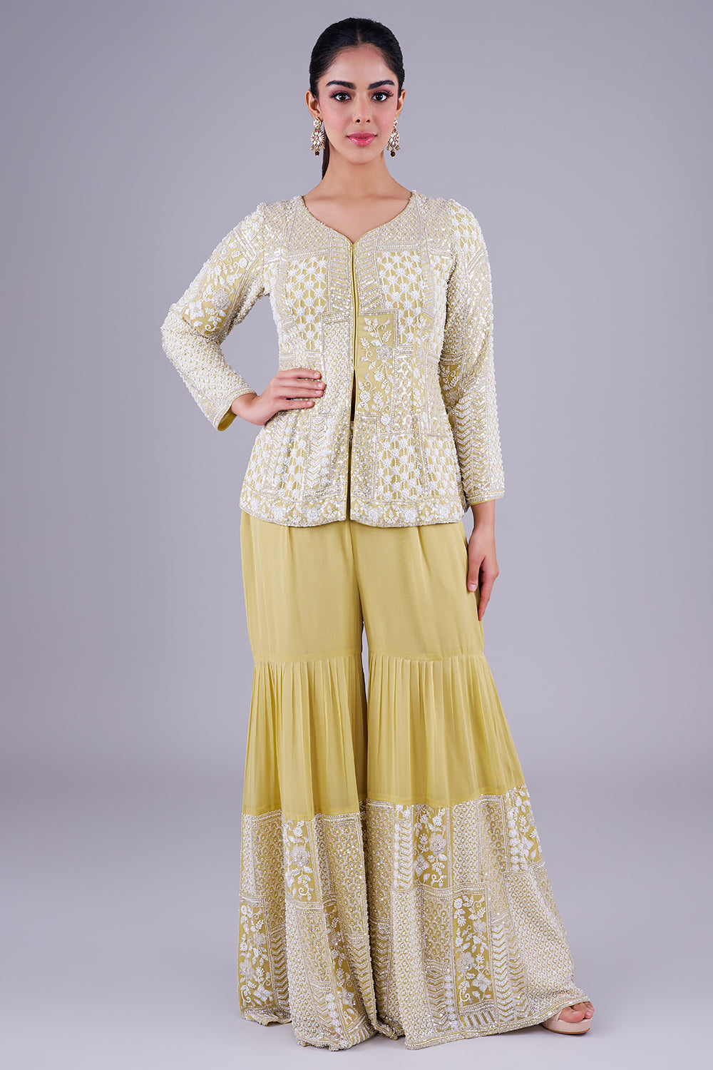 pastel lime peplum sharara set adorned with intricate ivory sequin patchwork embroidery.