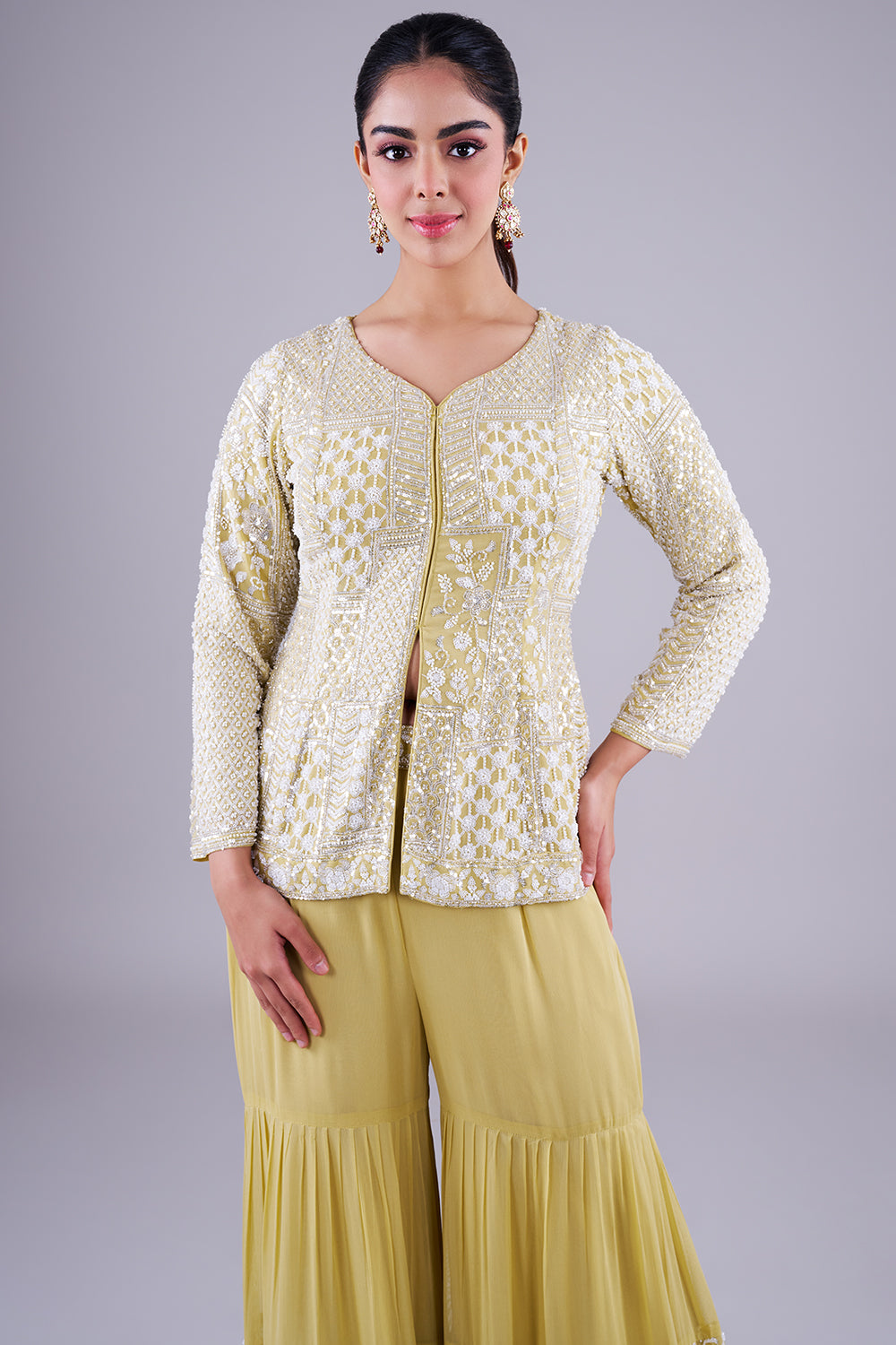pastel lime peplum sharara set adorned with intricate ivory sequin patchwork embroidery.