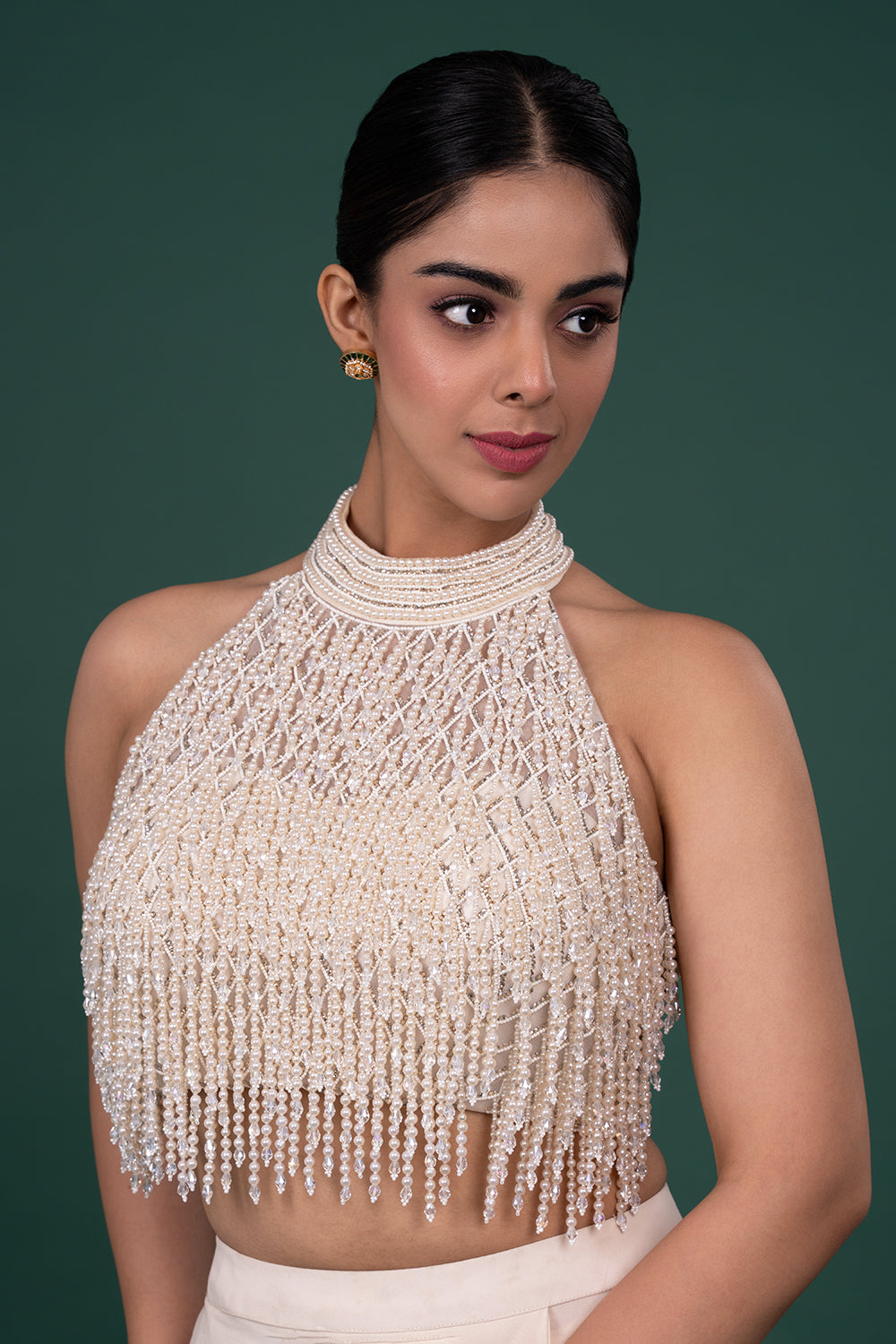 Cream Georgette saree with pearl encrusted halter blouse