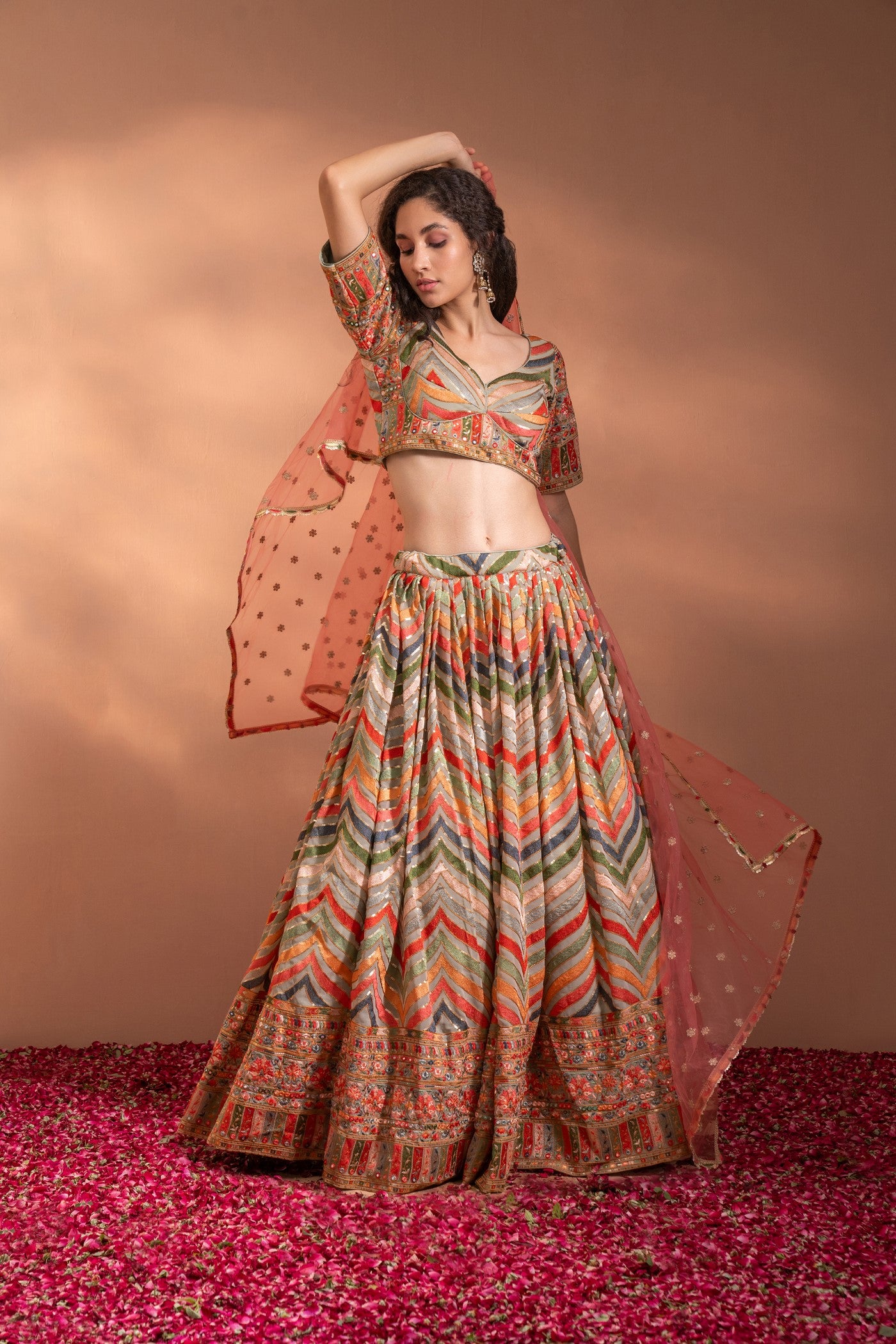Multi Colour Lehenga set in Cotton-Satin Fabric with heavy threadwork, sequence, arri work & Net Dupatta.