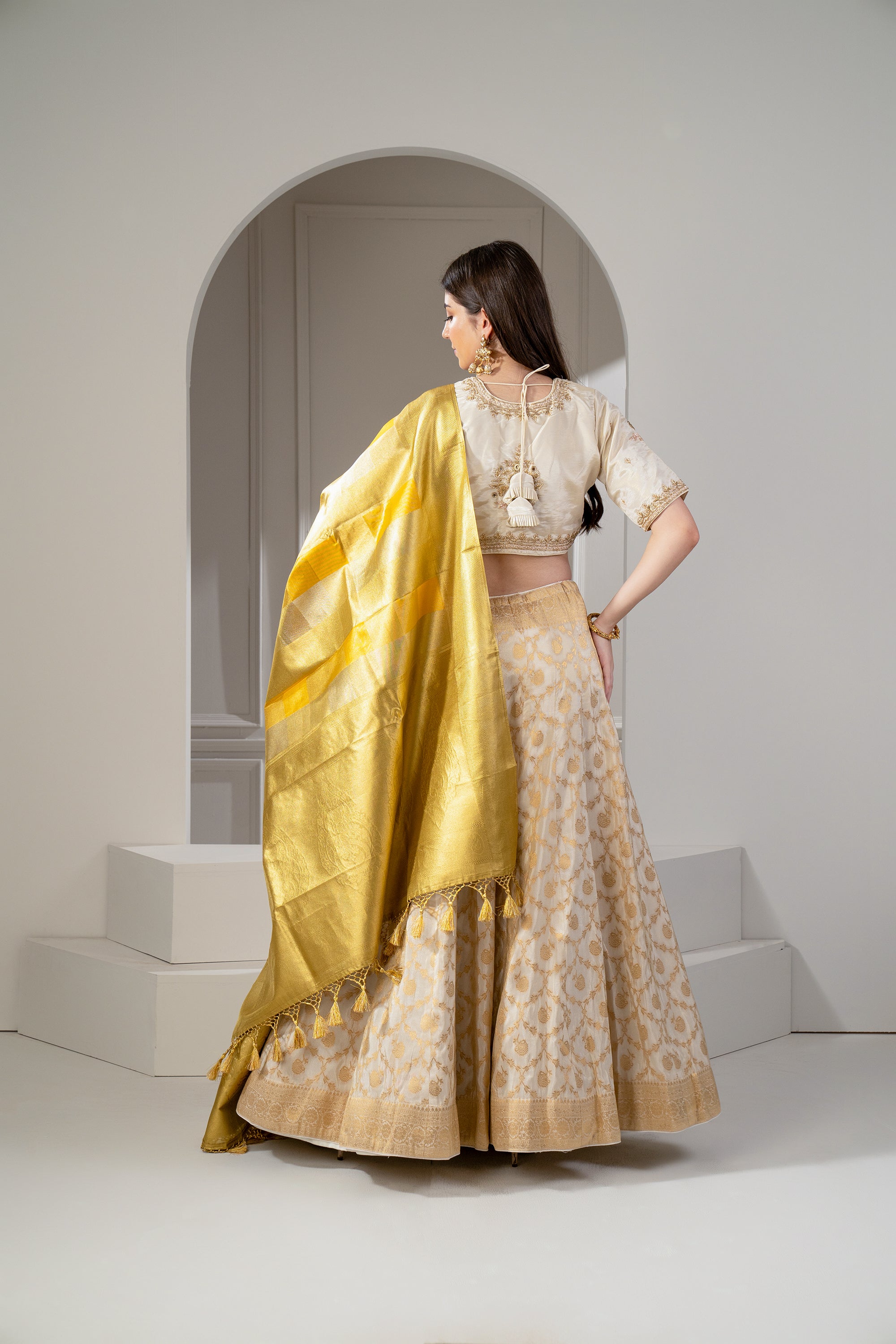 Sunglow Golden And Beige Banarasi Silk Zari Embroidered Lehenga Set.