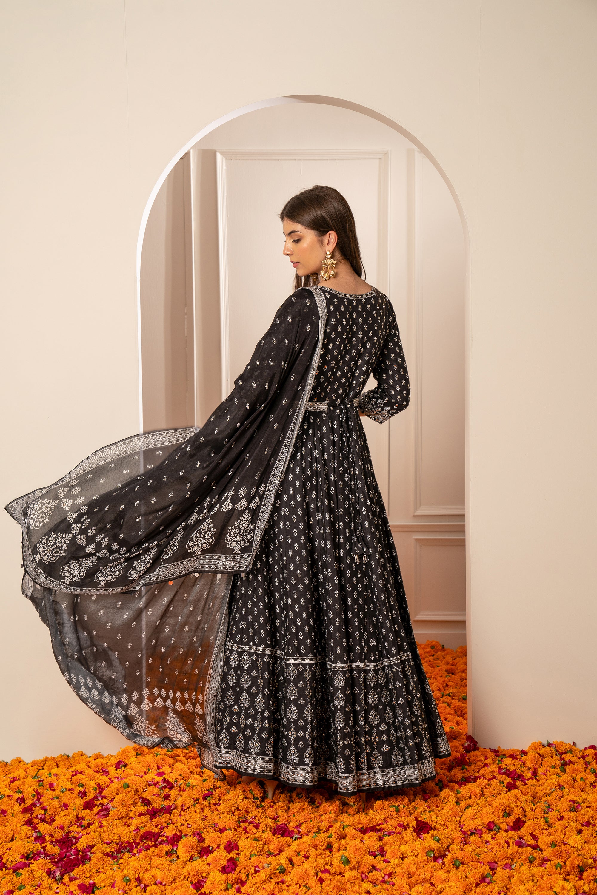Charcoal Black Semi Silk Printed Gown with Mirror Embellishments.