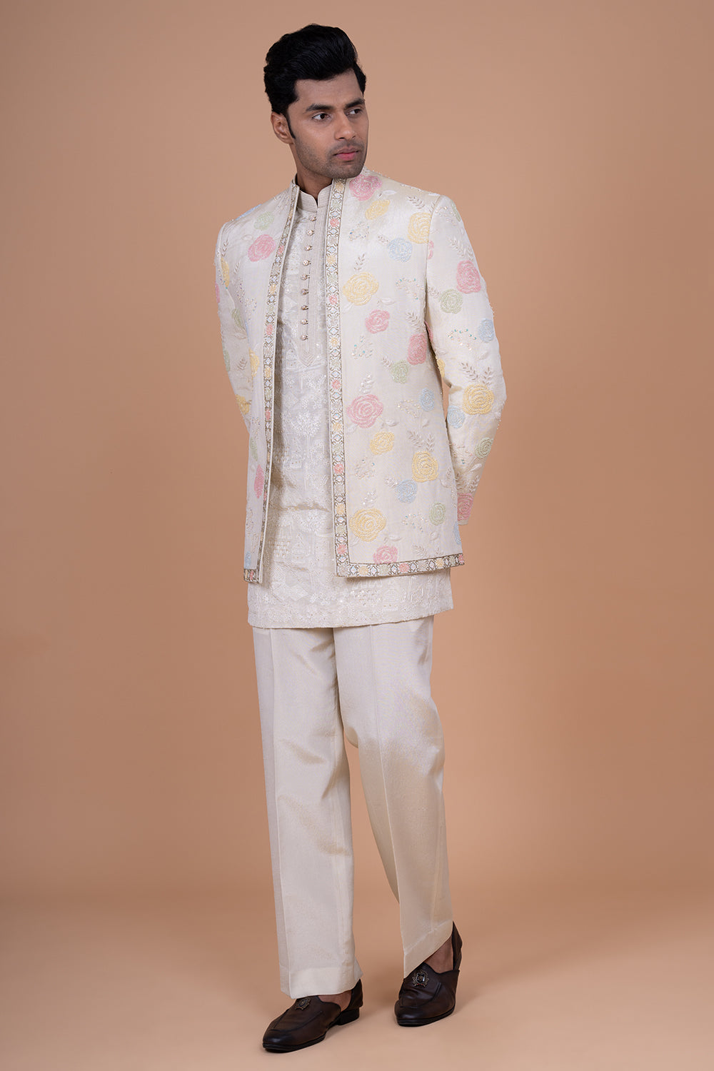 Ivory Raw Silk Bundi Jacket with Pastel Floral Thread Work and Mirror Accents.
