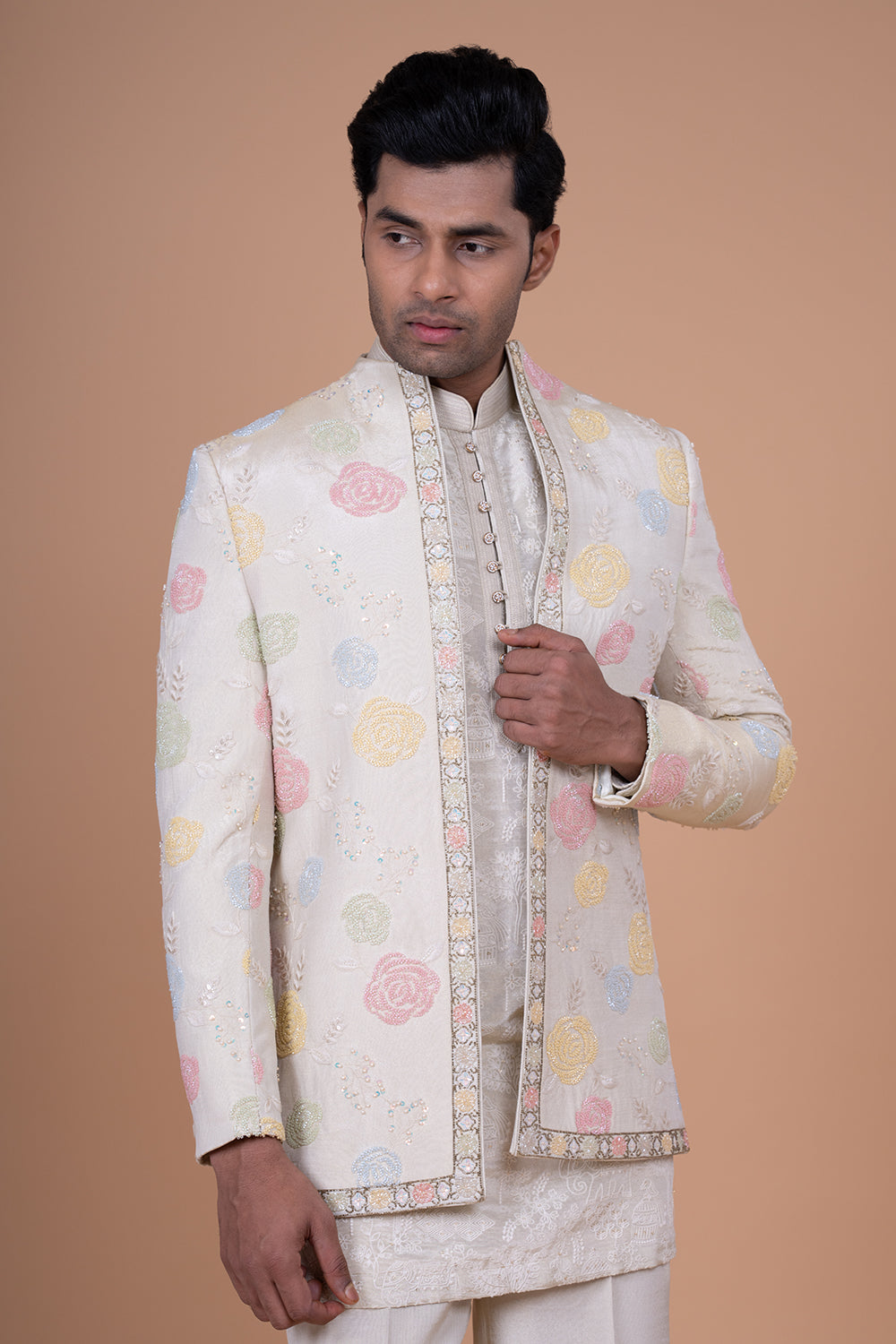 Ivory Raw Silk Bundi Jacket with Pastel Floral Thread Work and Mirror Accents.